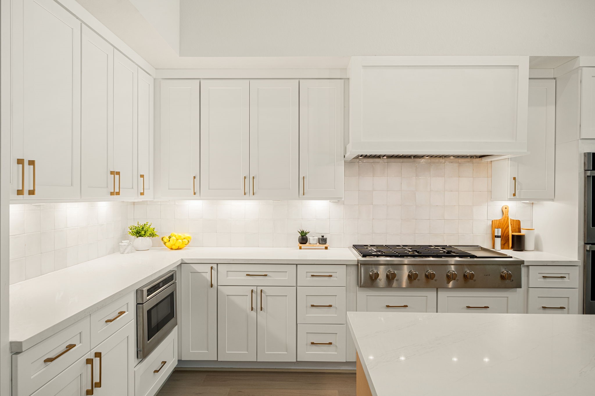 Beautifully appointed kitchen with abundant cabinetry, generous counter space, and a timeless neutral color palette.