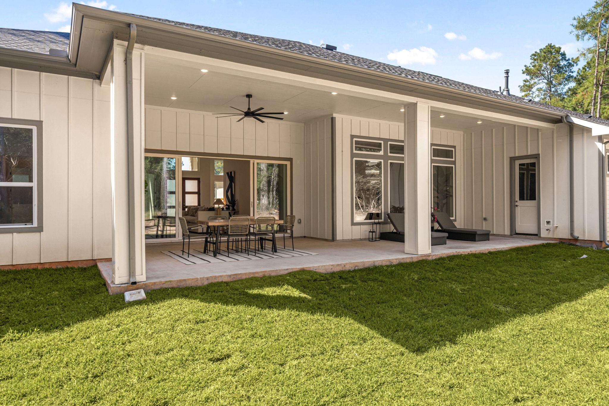 Spacious backyard with a covered patio and plenty of room for outdoor recreation.