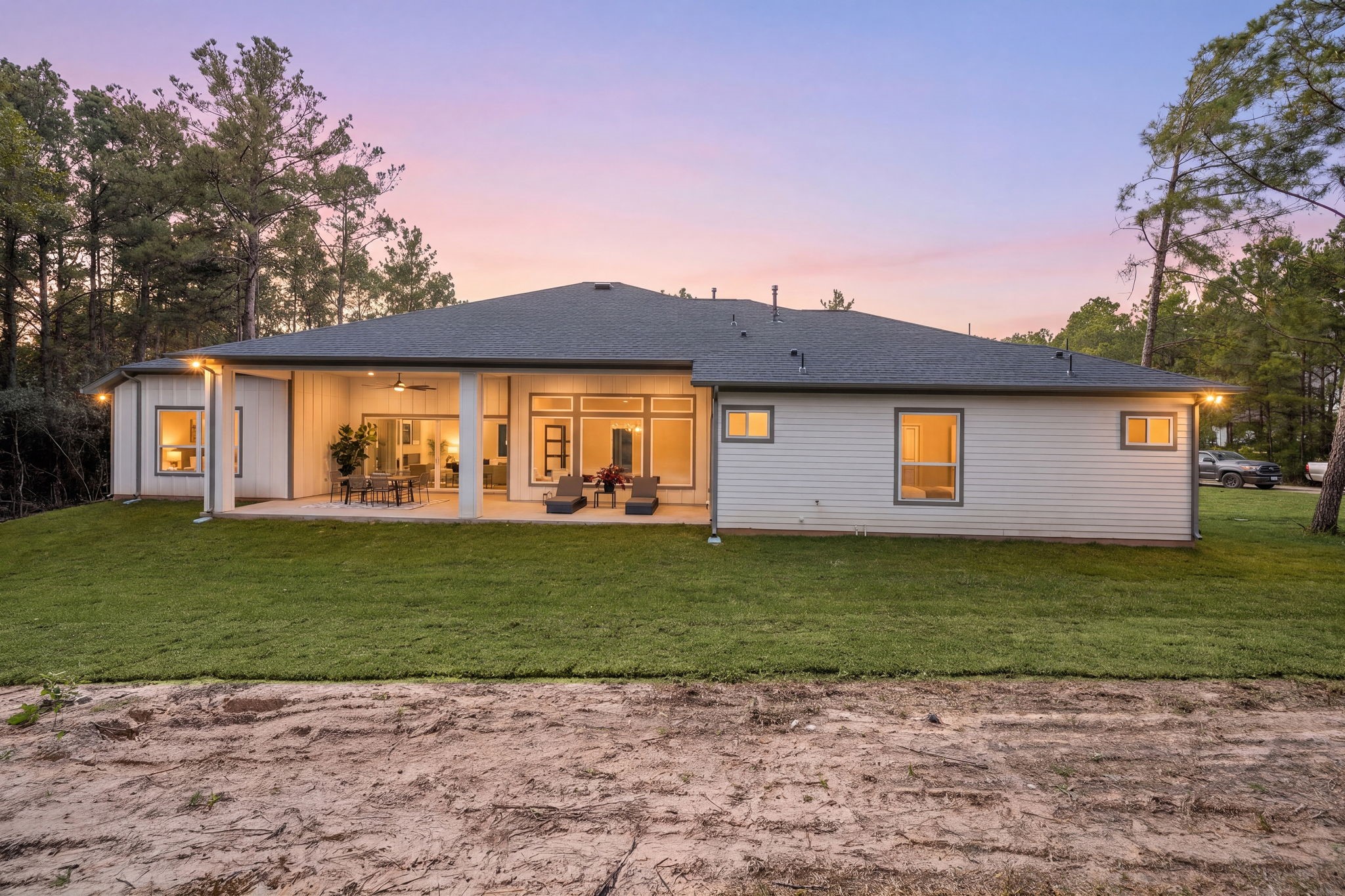 Beautiful twilight exterior showcasing the home's architectural design and inviting outdoor lighting.