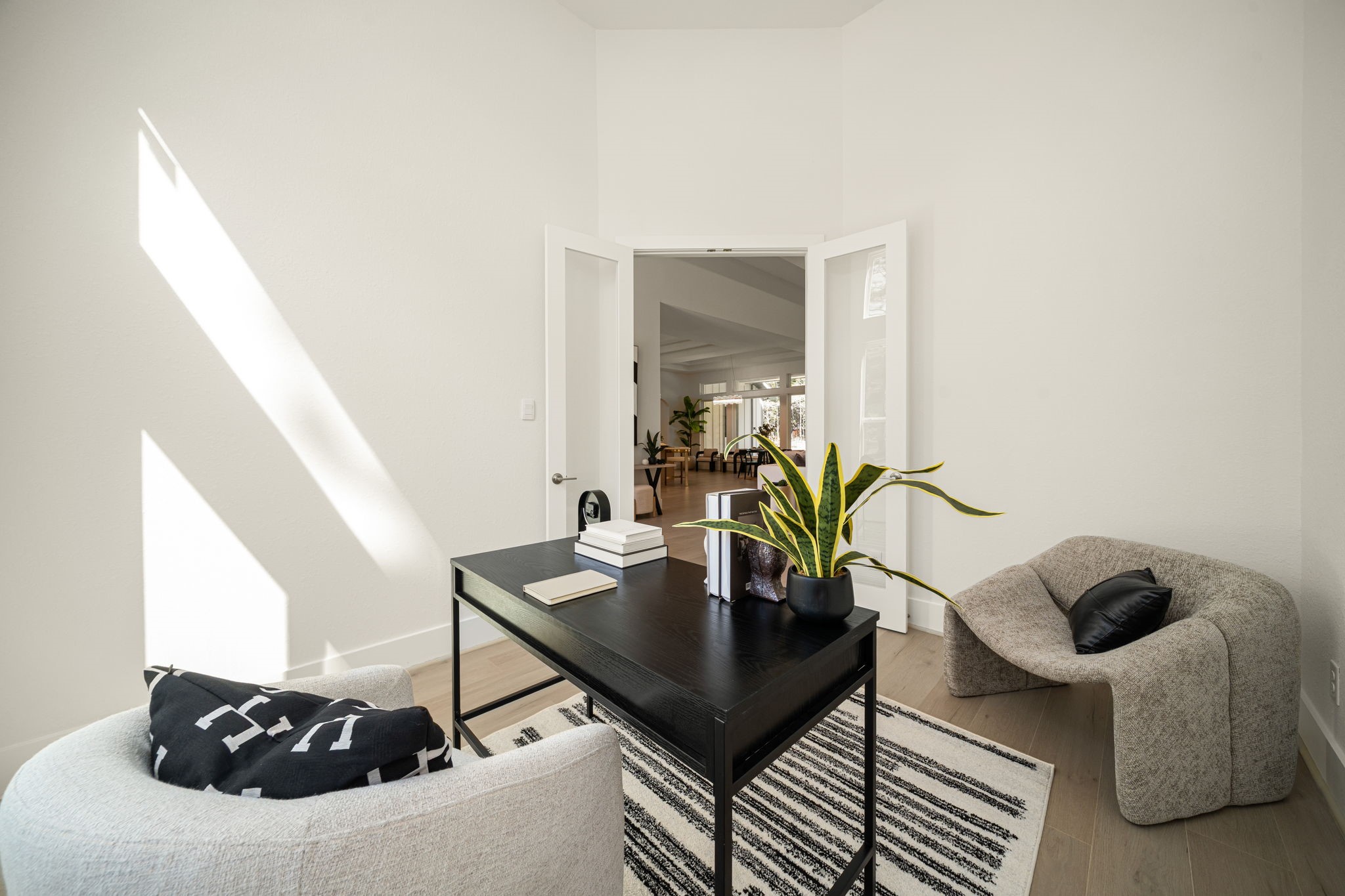 Stylish home office featuring beautiful natural light and a sophisticated workspace.