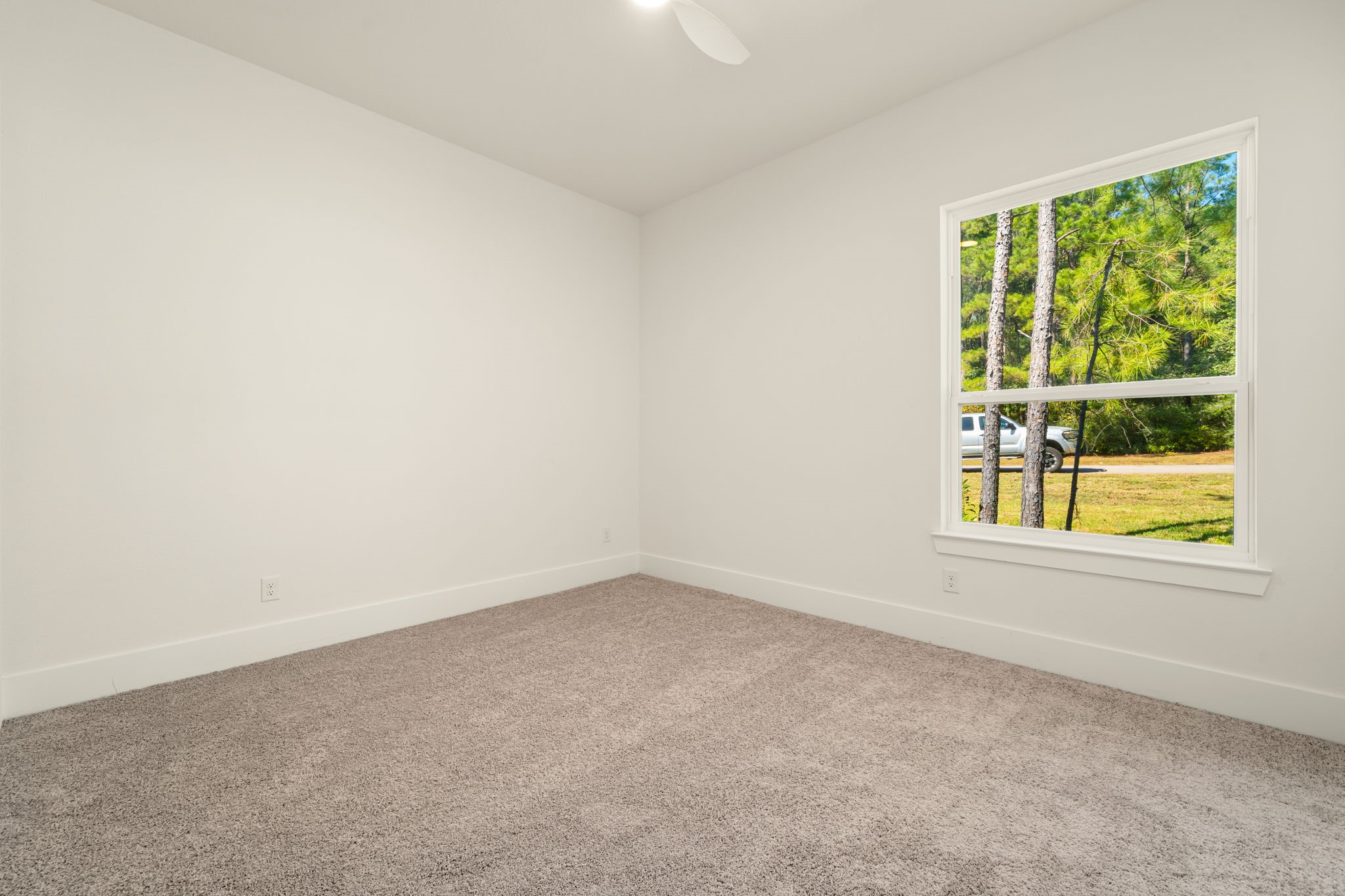 Generously sized secondary bedroom offering a versatile layout and abundant natural light.