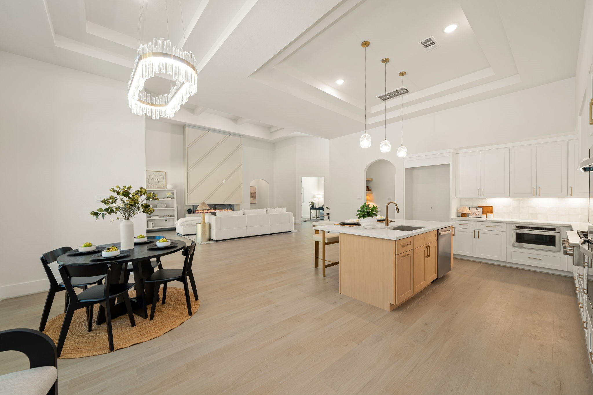 Expansive kitchen with an oversized center island and seamless flow into the adjoining breakfast area.
