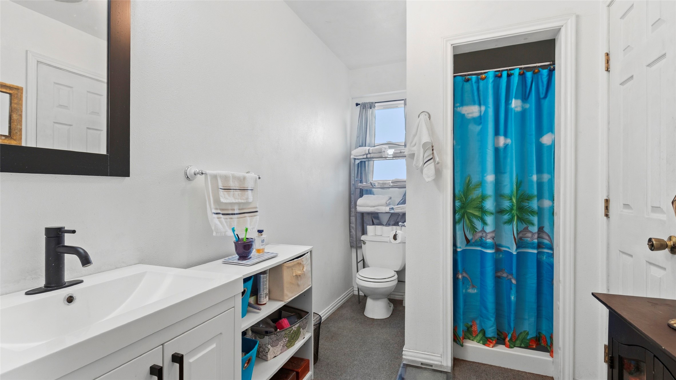 Downstairs boasts a large flexible ground-level suite complete with its own private bath and private entranceideal as a 3rd bedroom, guest quarters, or home office.