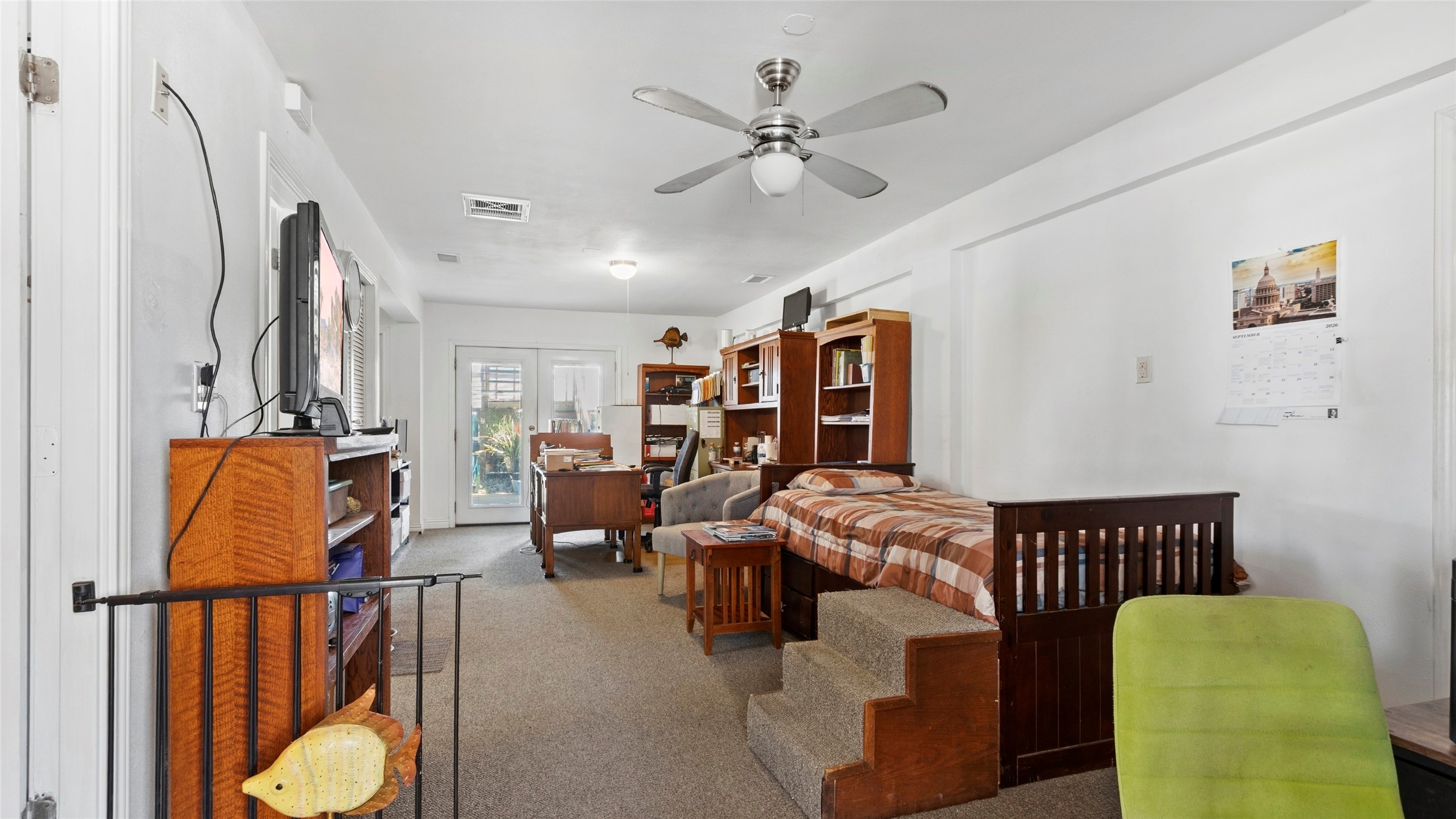Downstairs boasts a large flexible ground-level suite complete with its own private bath and private entranceideal as a 3rd bedroom, guest quarters, or home office.