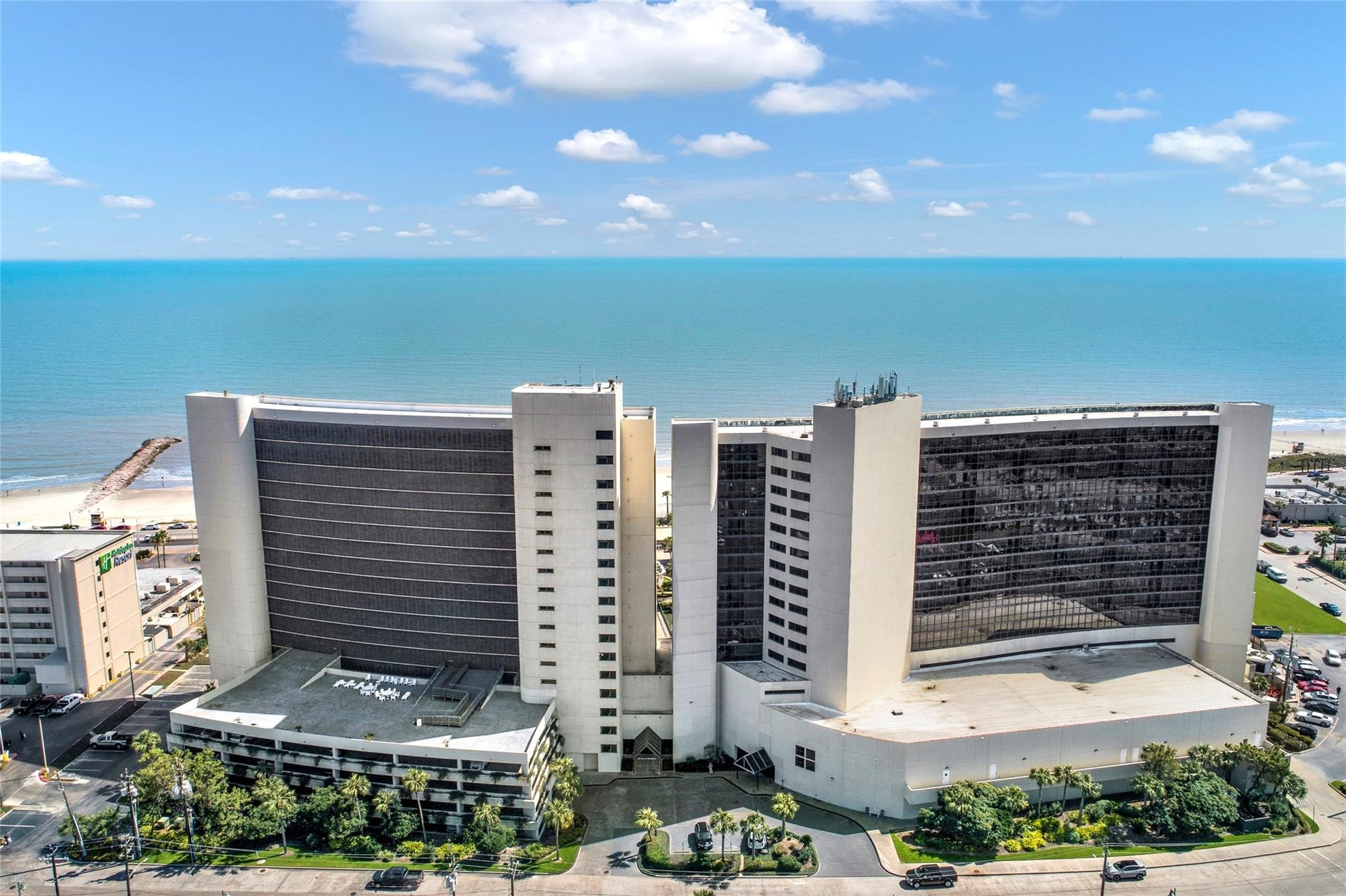 Oceanfront high-rise with stunning panoramic views, featuring modern architecture and direct beach access. Ideal for those seeking a vibrant coastal lifestyle.