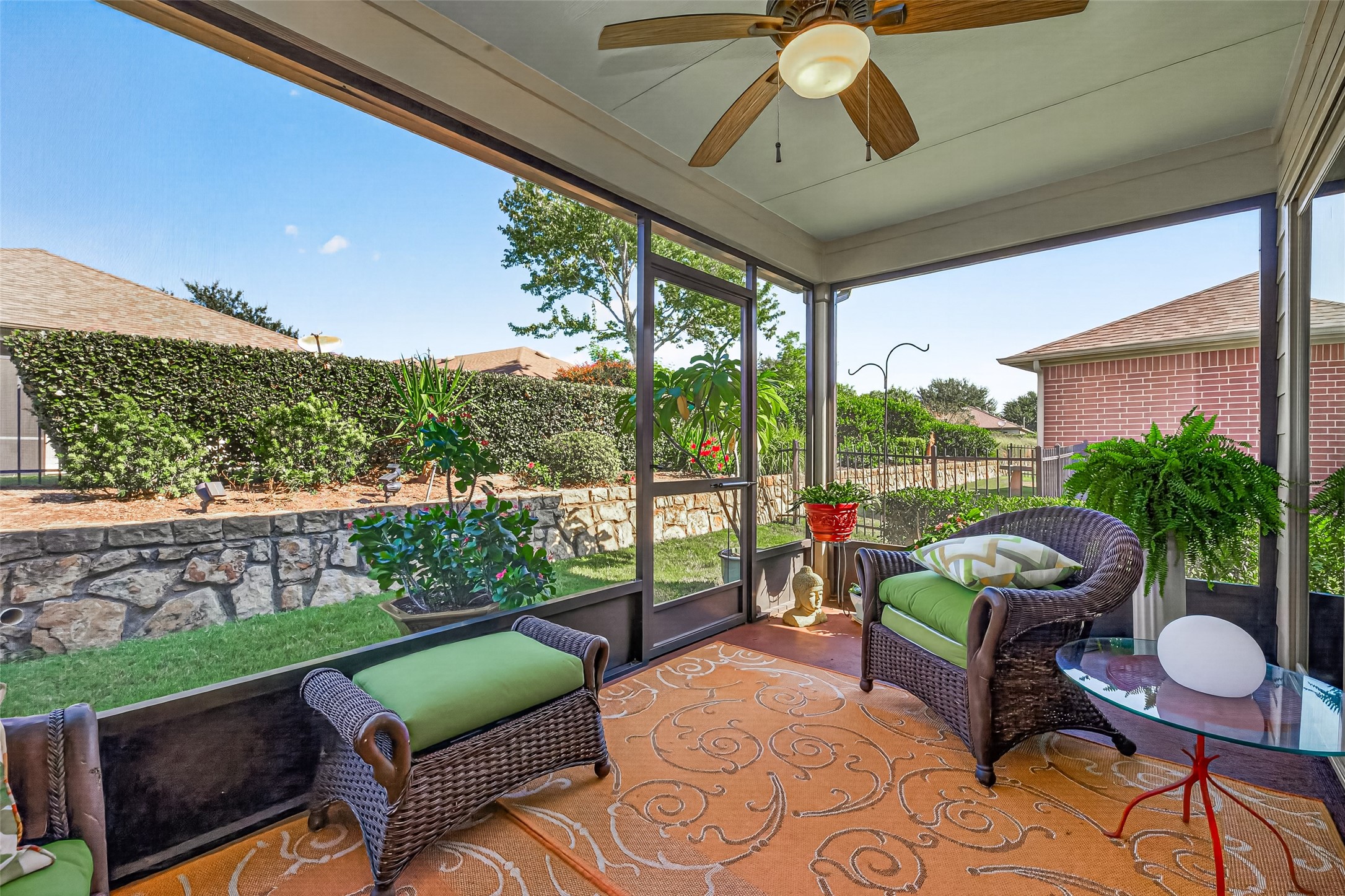 Enjoy morning coffee on the enclosed back porch overlooking the garden.