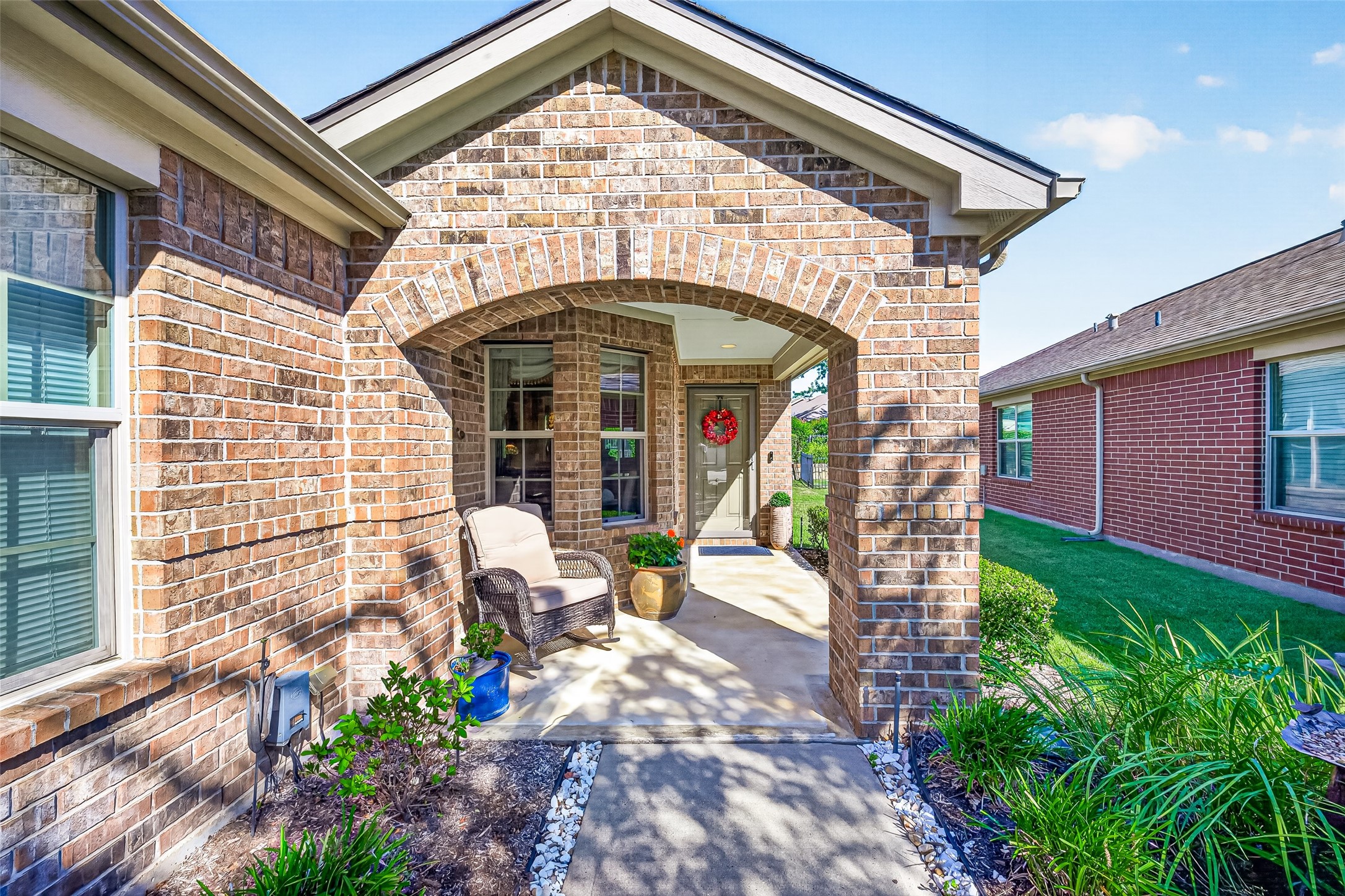 A charming arched entrance makes a warm first impression. A charming arched entrance makes a warm first impression.