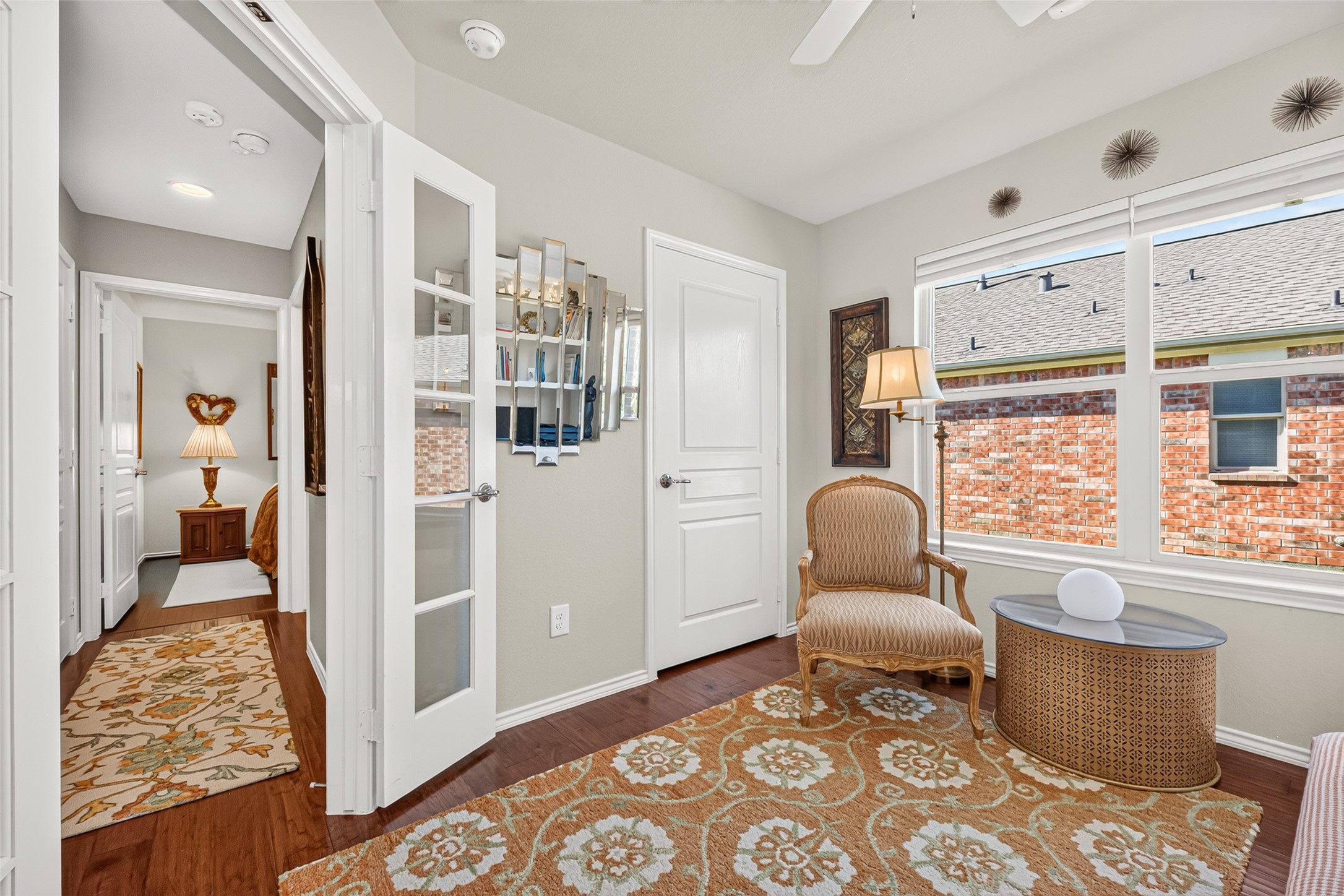 Glass-pane French doors add charm and privacy to the office.