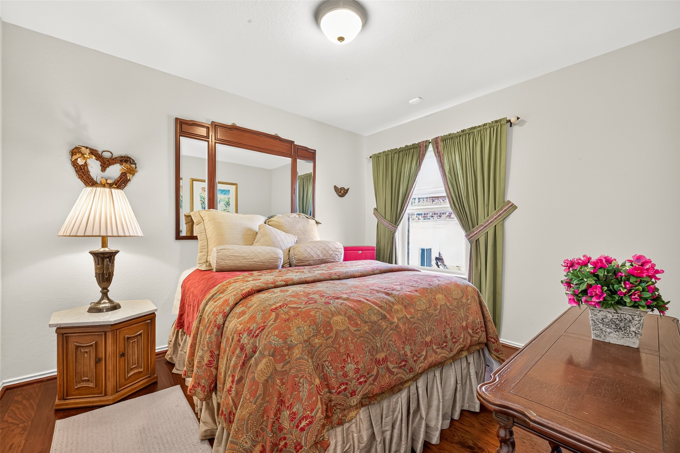 A comfortable guest bedroom with natural light and room to settle in.