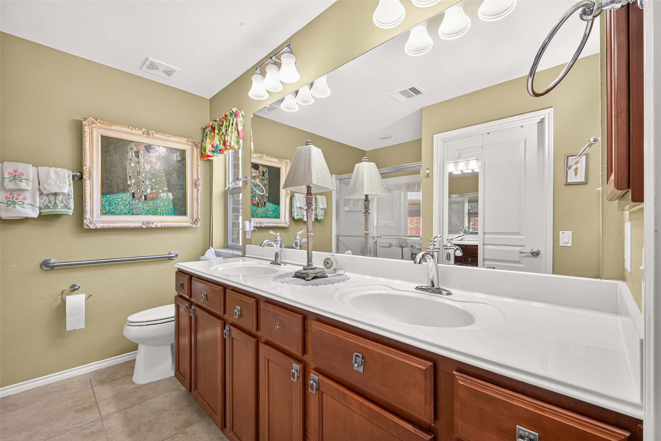 Dual sinks and ample storage make daily routines easier.