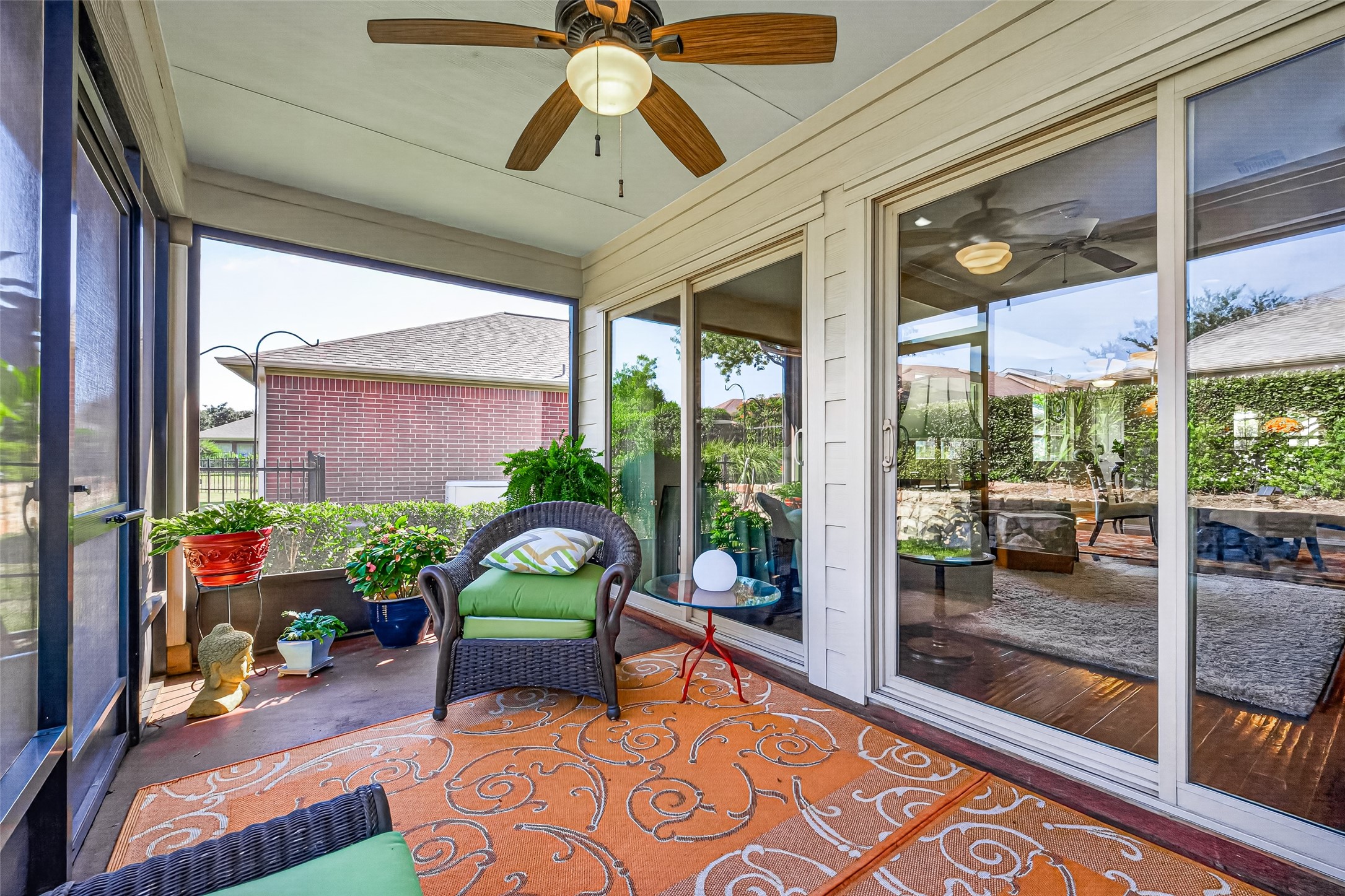 Sliding glass doors connect indoor comfort with porch-side relaxation.
