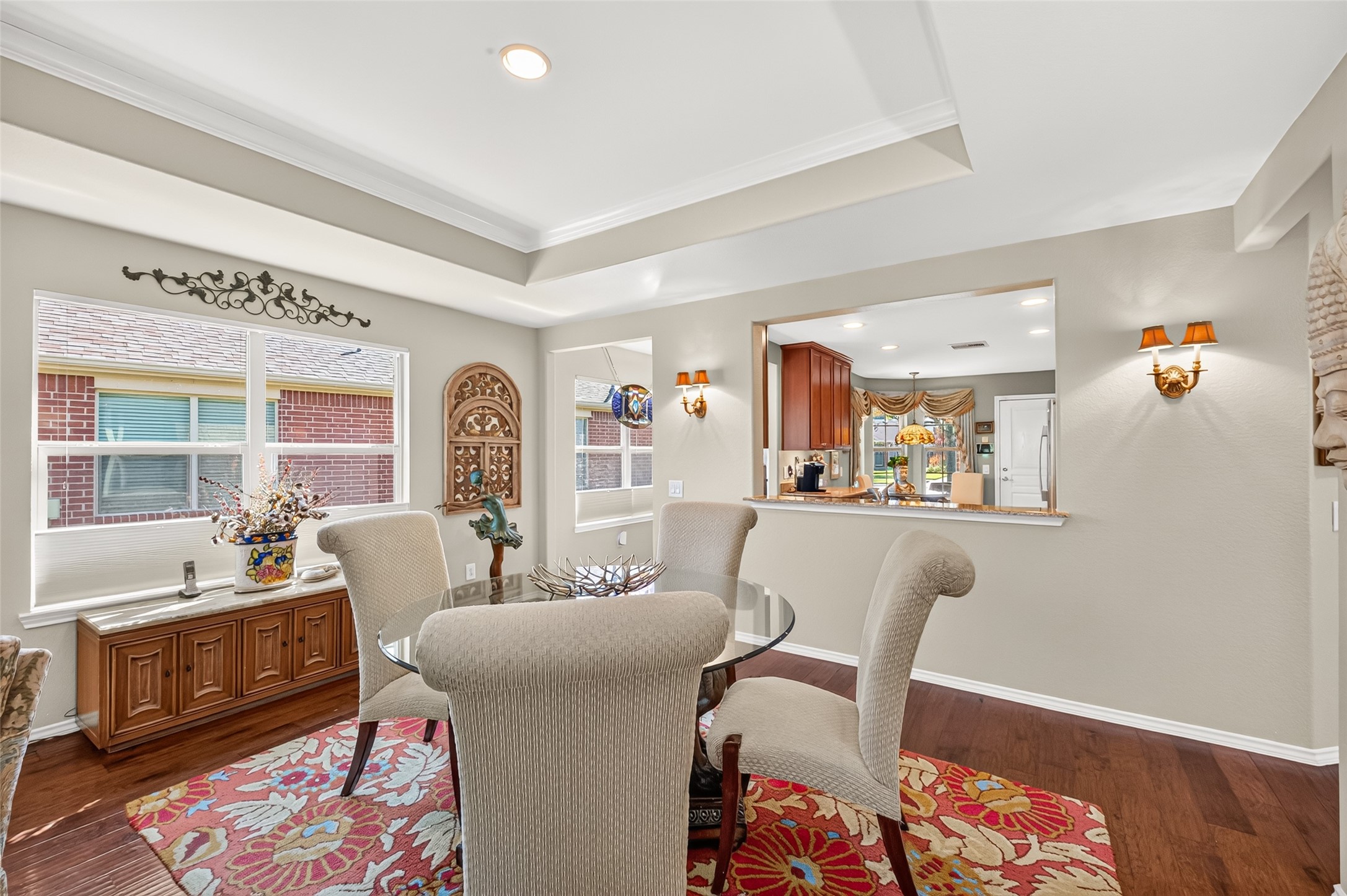 Tray ceilings and hardwood floors add character to the dining space. Tray ceilings and hardwood floors add character to the dining space.