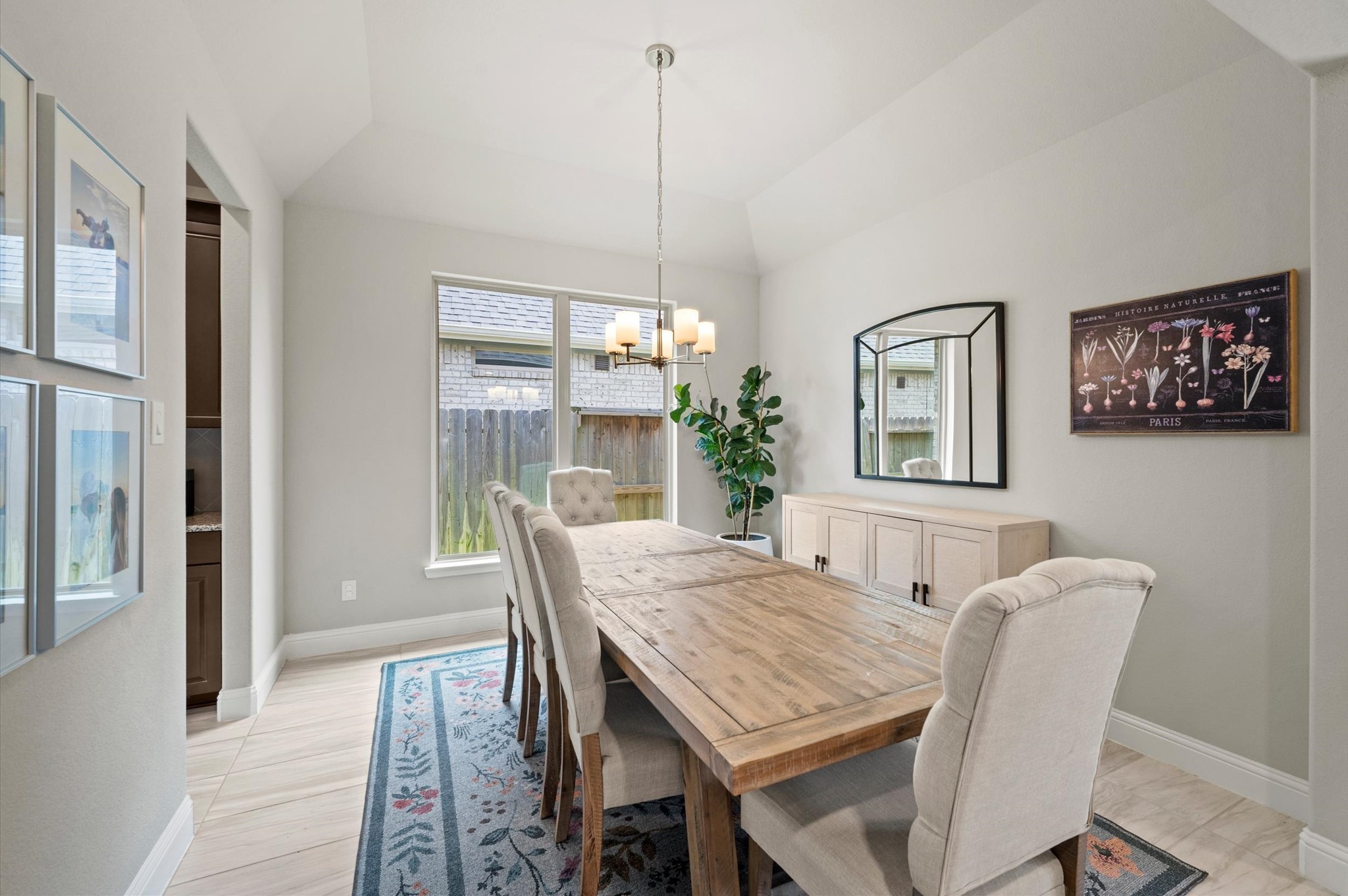 Formal dining room with high ceilings, and abundant natural light.