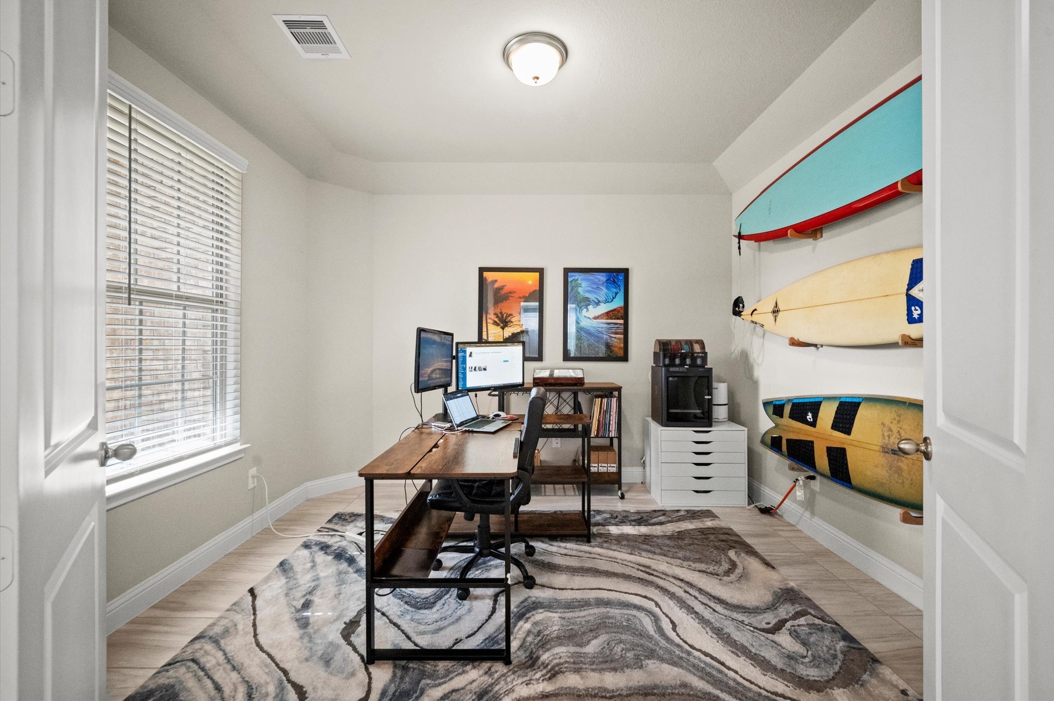 Bright and inviting home office located at the front of the home.