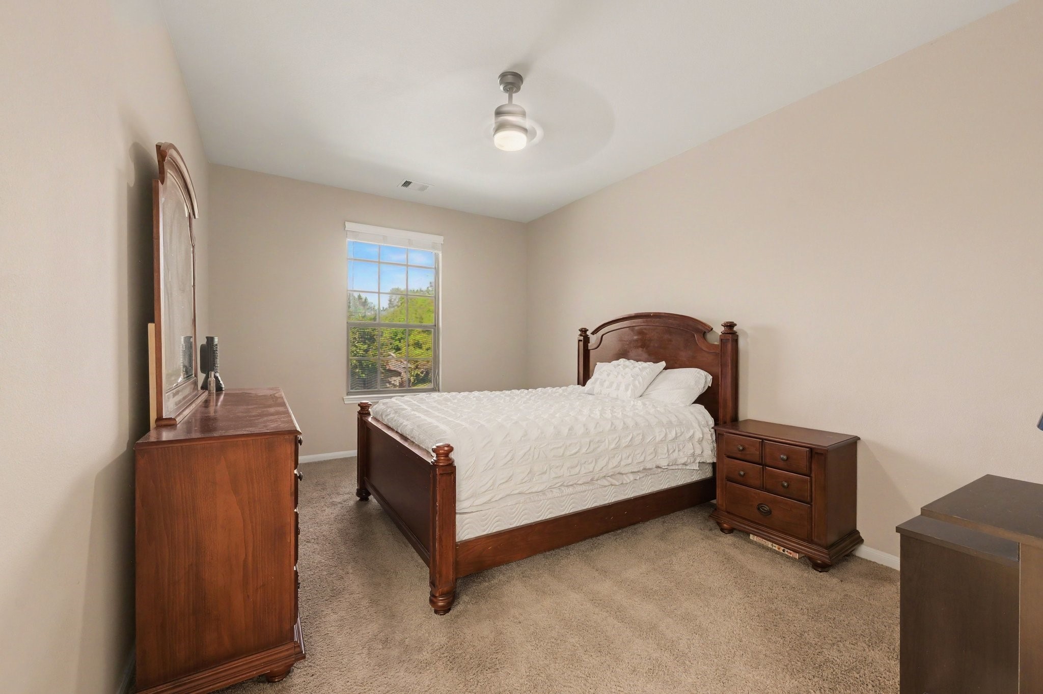 One of two secondary bedrooms upstairs with a shared Jack-n-Jill bathroom