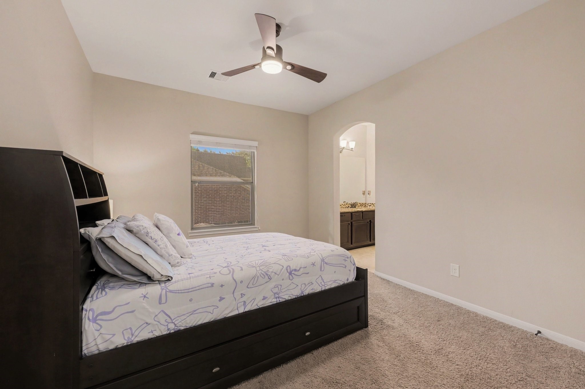 One of two secondary bedrooms upstairs with a shared Jack-n-Jill bathroom