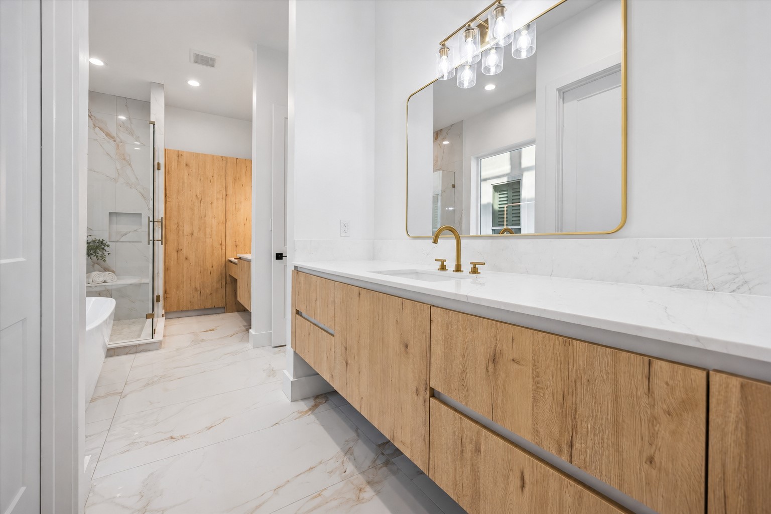 A closer up view of the second vanity in the primary bath! Tons of storage plus a private water closet. Large walk-in closet!