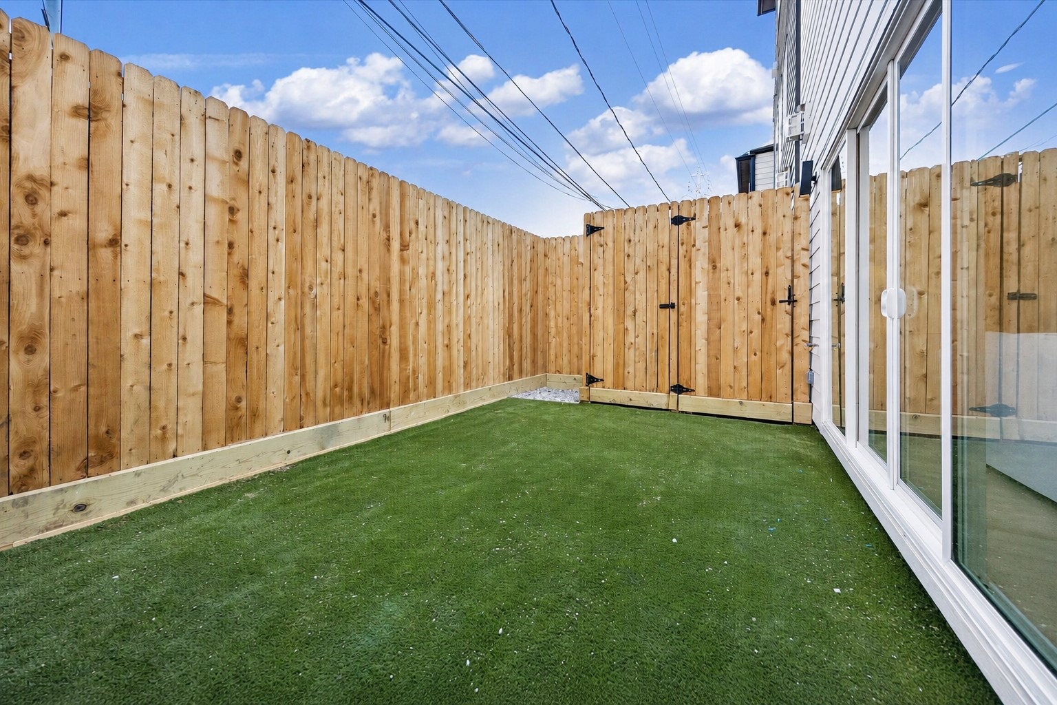 A sneak peek at this maintenance-free turfed fully fenced backyard