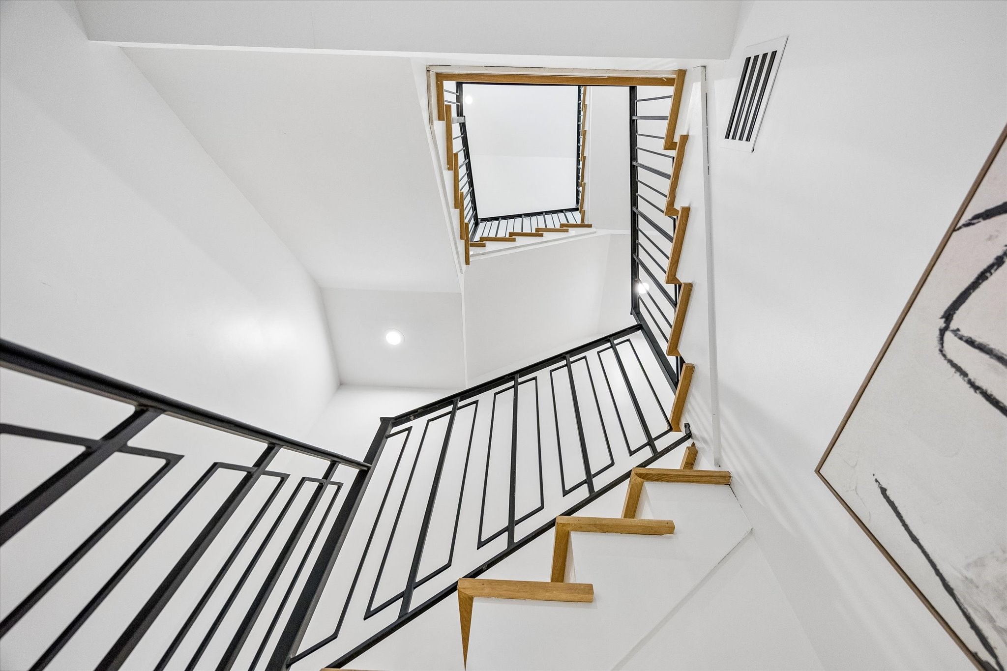 A view on the first floor looking up the sleek staircase!