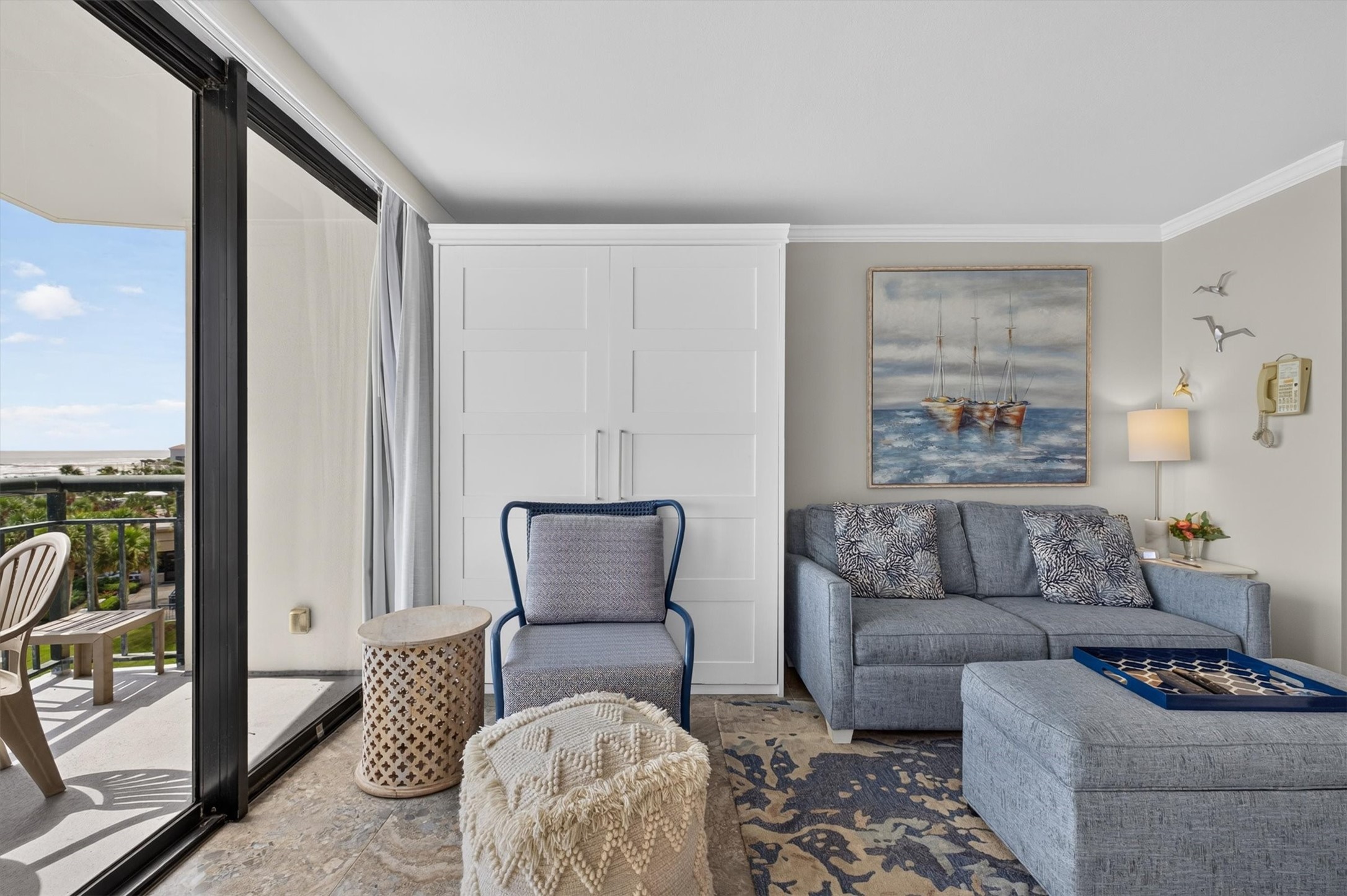 THE MURPHY  BED IS TO THE LEFT OF THE SOFA.