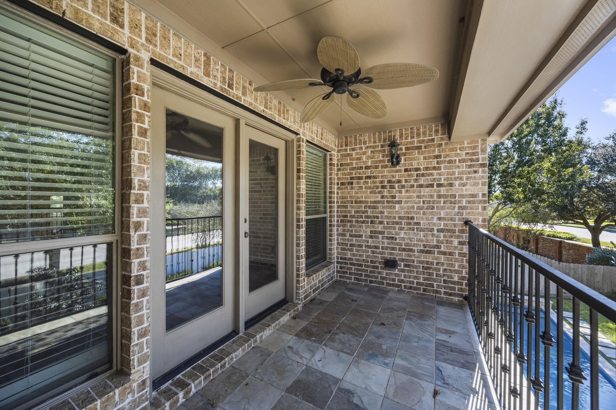 enjoy the outdoors on this private balcony overlooking the backyard