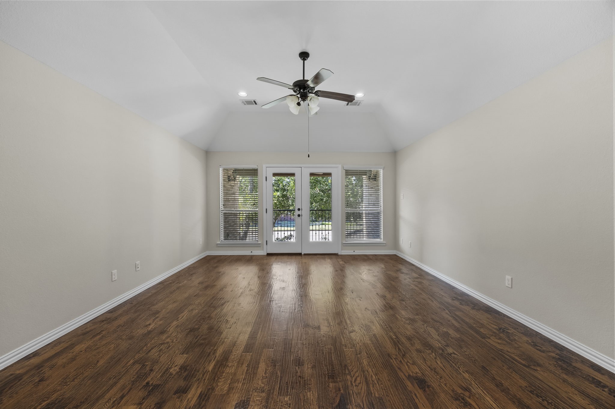 Massive Game Room that leads out to a covered 2nd story balcony.