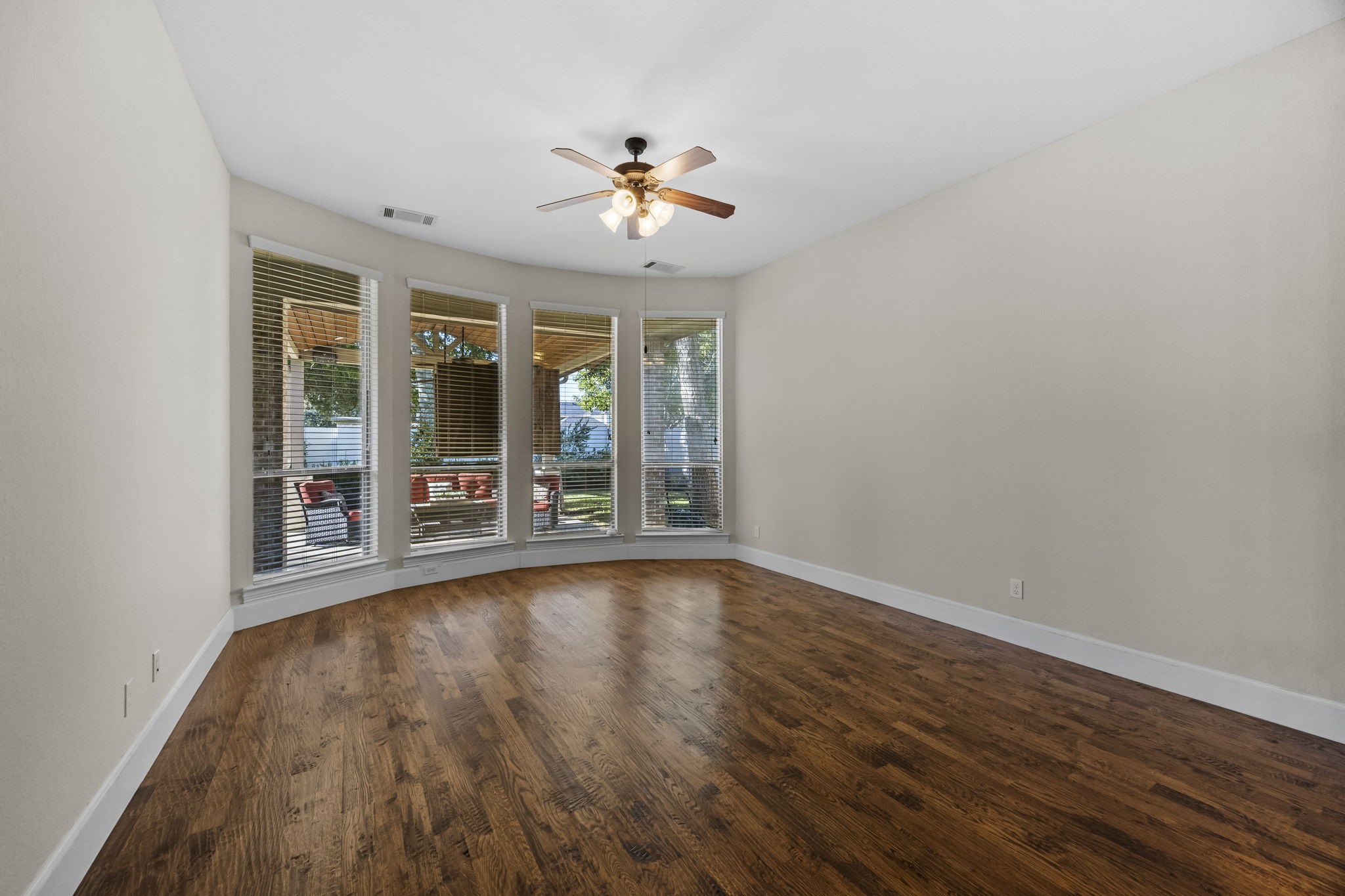 View of the oversized primary bedroom with a bay window offering extra space