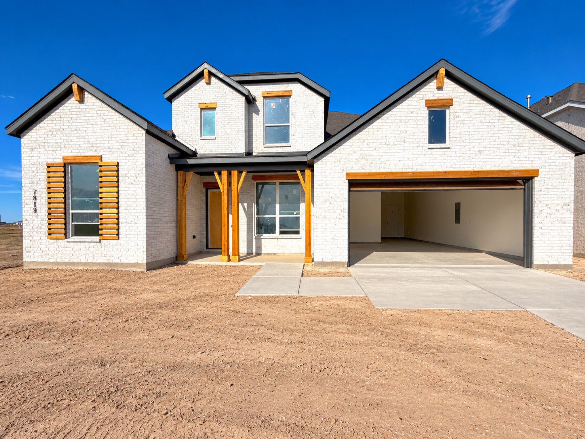 Stunning curb appeal with modern architecture and a spacious 3 car tandem garage