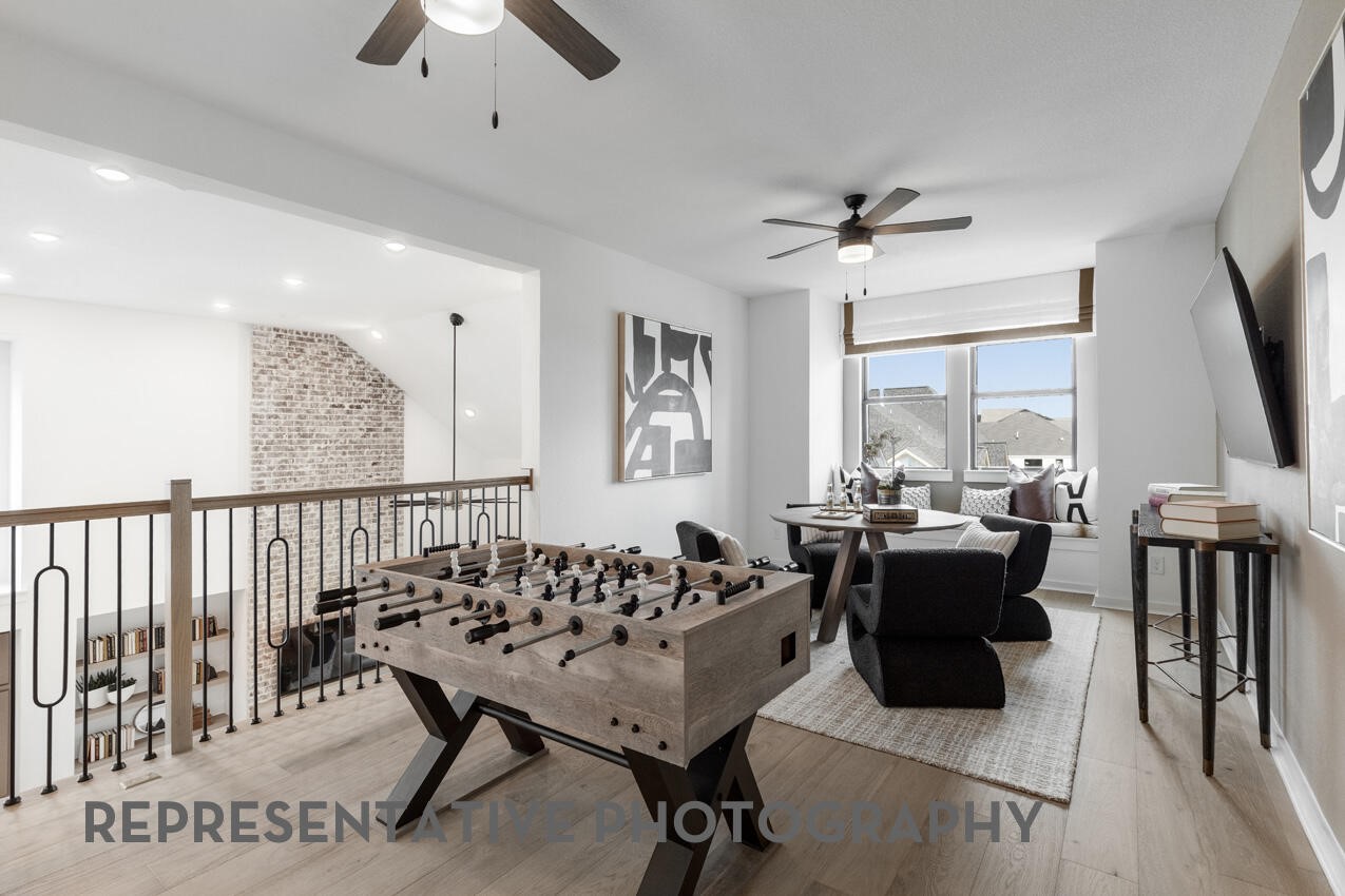 Spacious upstairs game room offering plenty of room for recreation and entertaining.