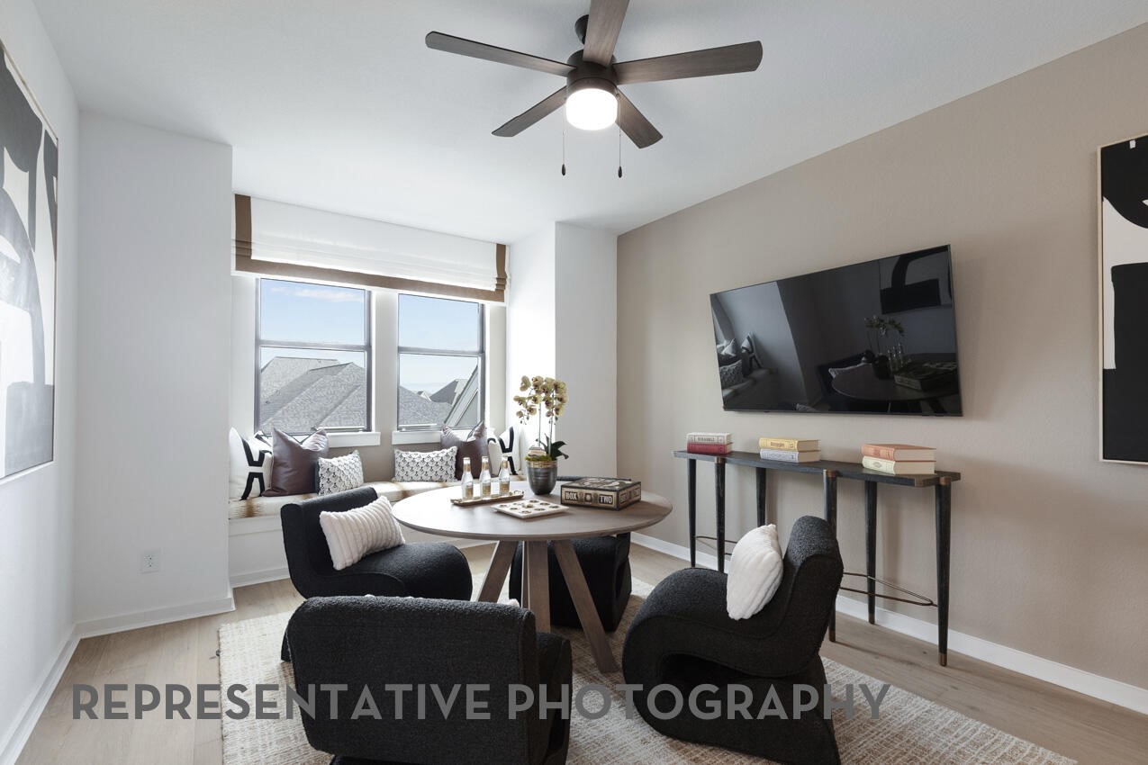 Versatile game room with space for a media area, gaming, or additional living space.