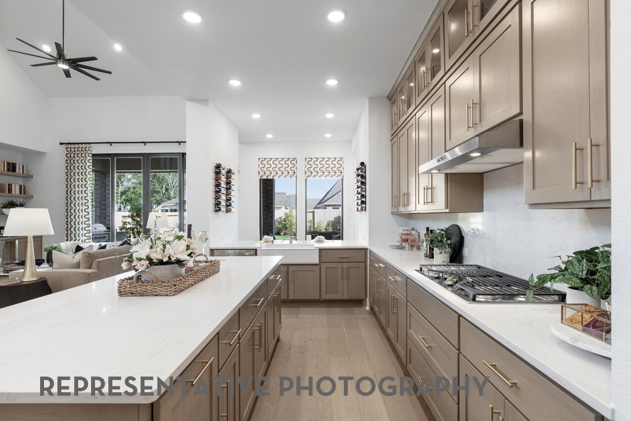 Chef-inspired kitchen with a gas cooktop, built-in appliances, and a large island perfect for entertaining.