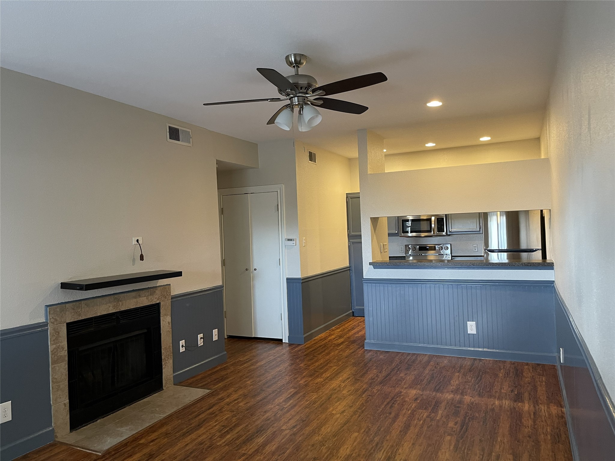 The open layout flows seamlessly into the kitchen, with a breakfast bar that provides additional seating and a natural gathering spot for everyday living.
