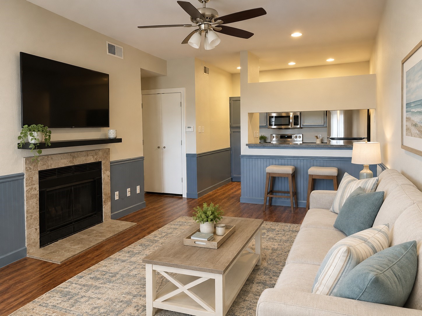 Virtually staged to highlight the rooms versatility, with space to relax by the fireplace, enjoy a casual meal at the kitchen bar, or gather with friends while staying connected to the heart of the home.