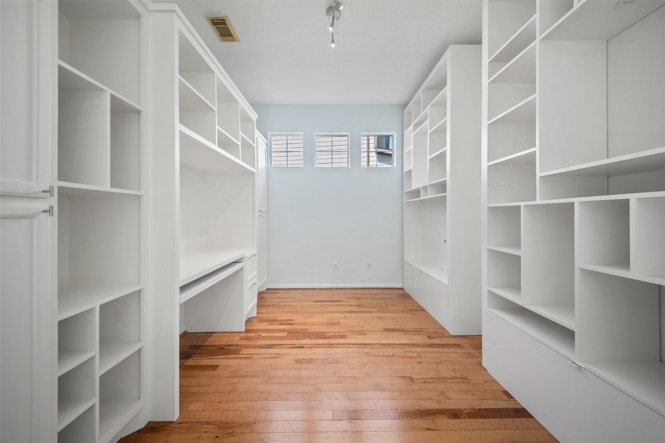 office area with built in cabinetry. cabinetry on the right of this photo is not built in, and can be remover for added floor space!
