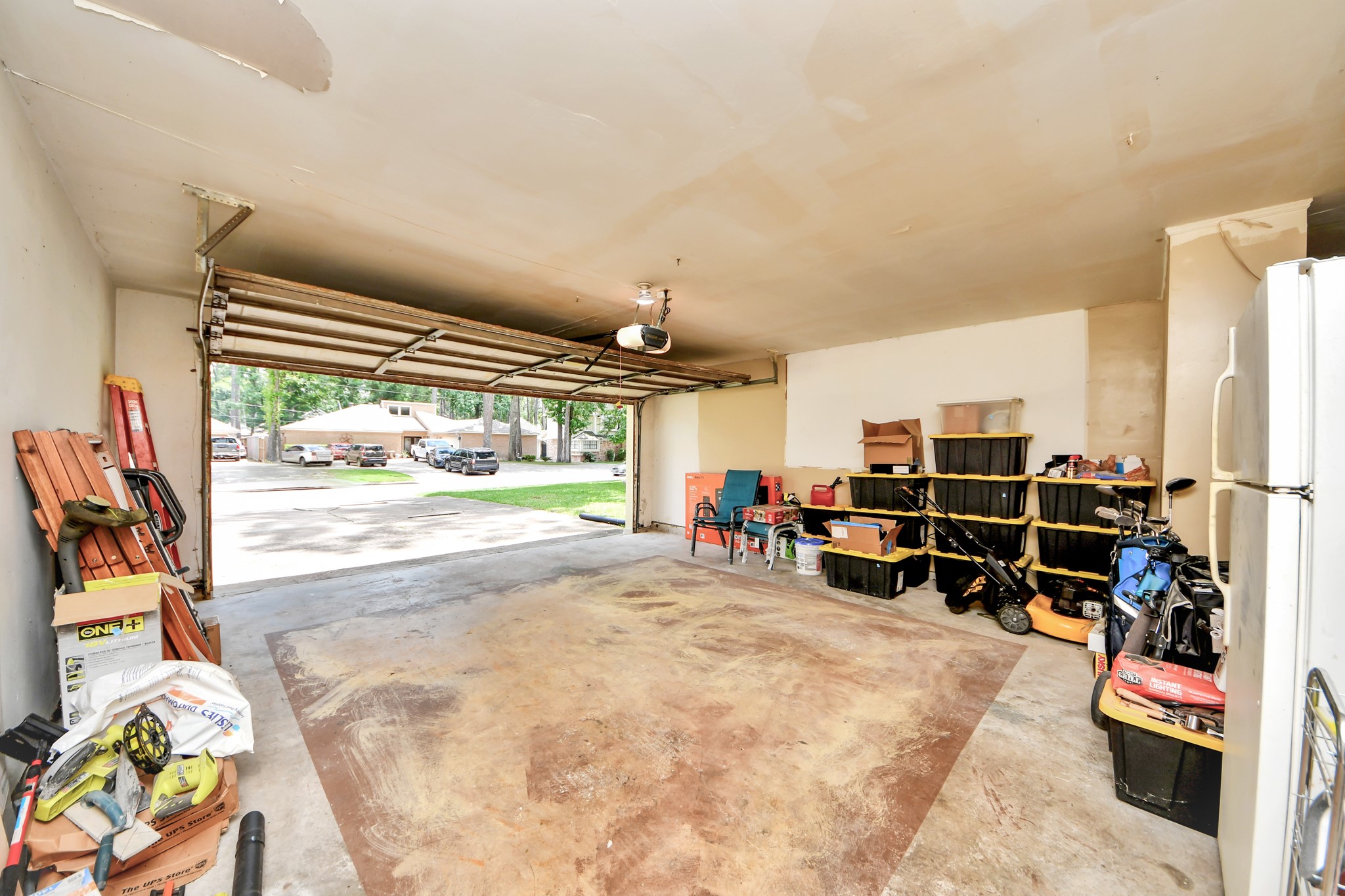 Remarkably spacious, this multi-car garage easily accommodates vehicles while leaving plenty of room for a workshop or extra storage.