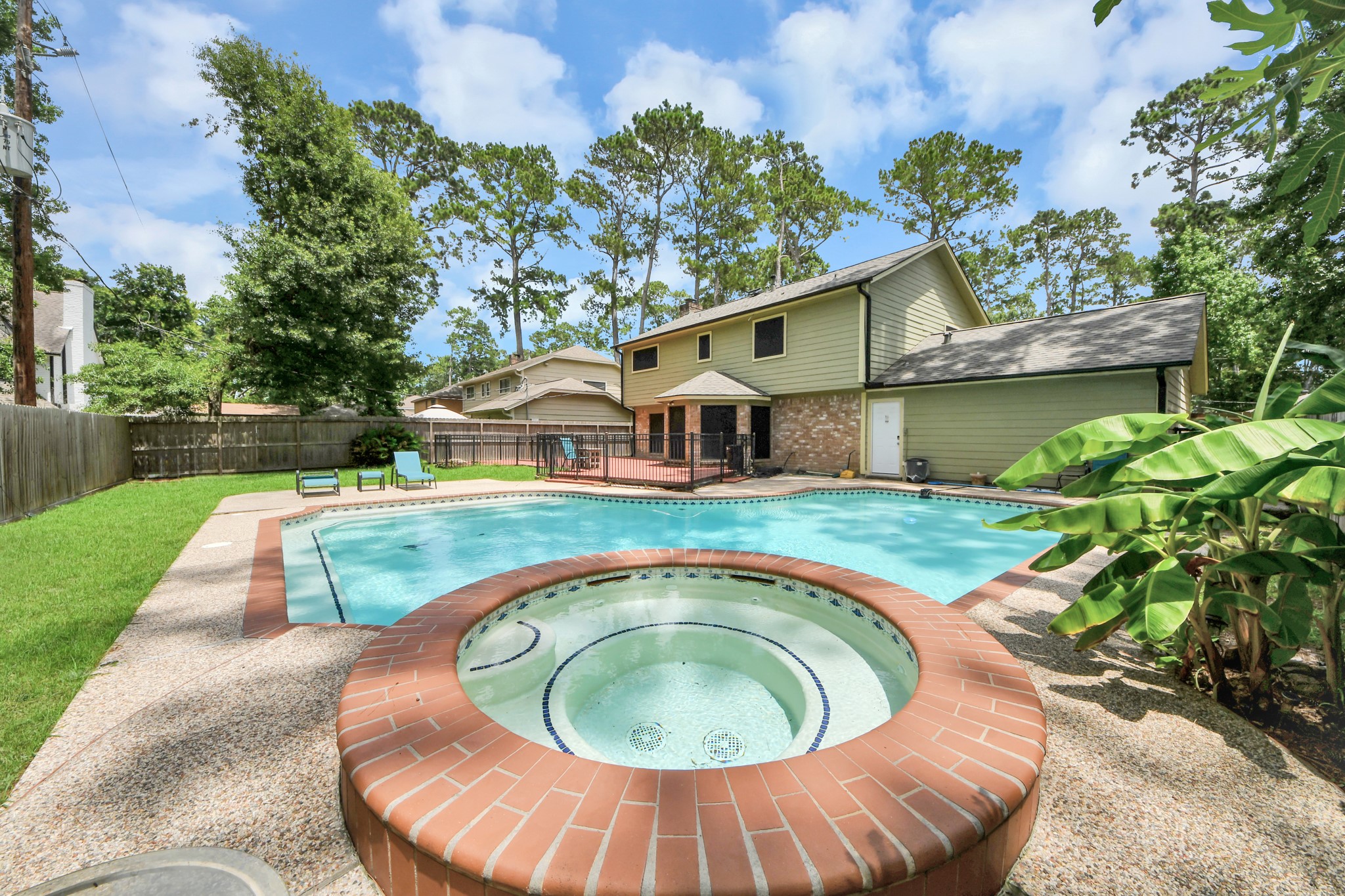 Your personal hydrotherapy retreat. This circular spa is attached to the main pool body, set against the handsome rear elevation of the home.