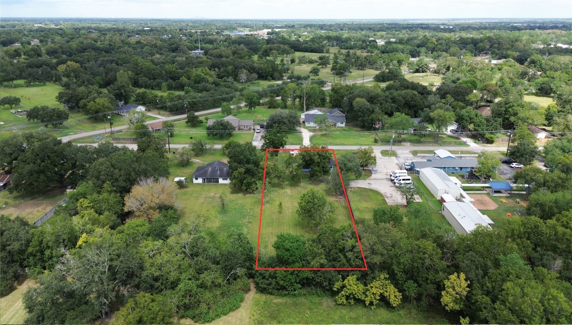 Discover a spacious lot embraced by lush greenery, offering privacy and a serene setting for your dream home, all while enjoying the tranquility of a rural neighborhood with convenient access to nearby amenities.