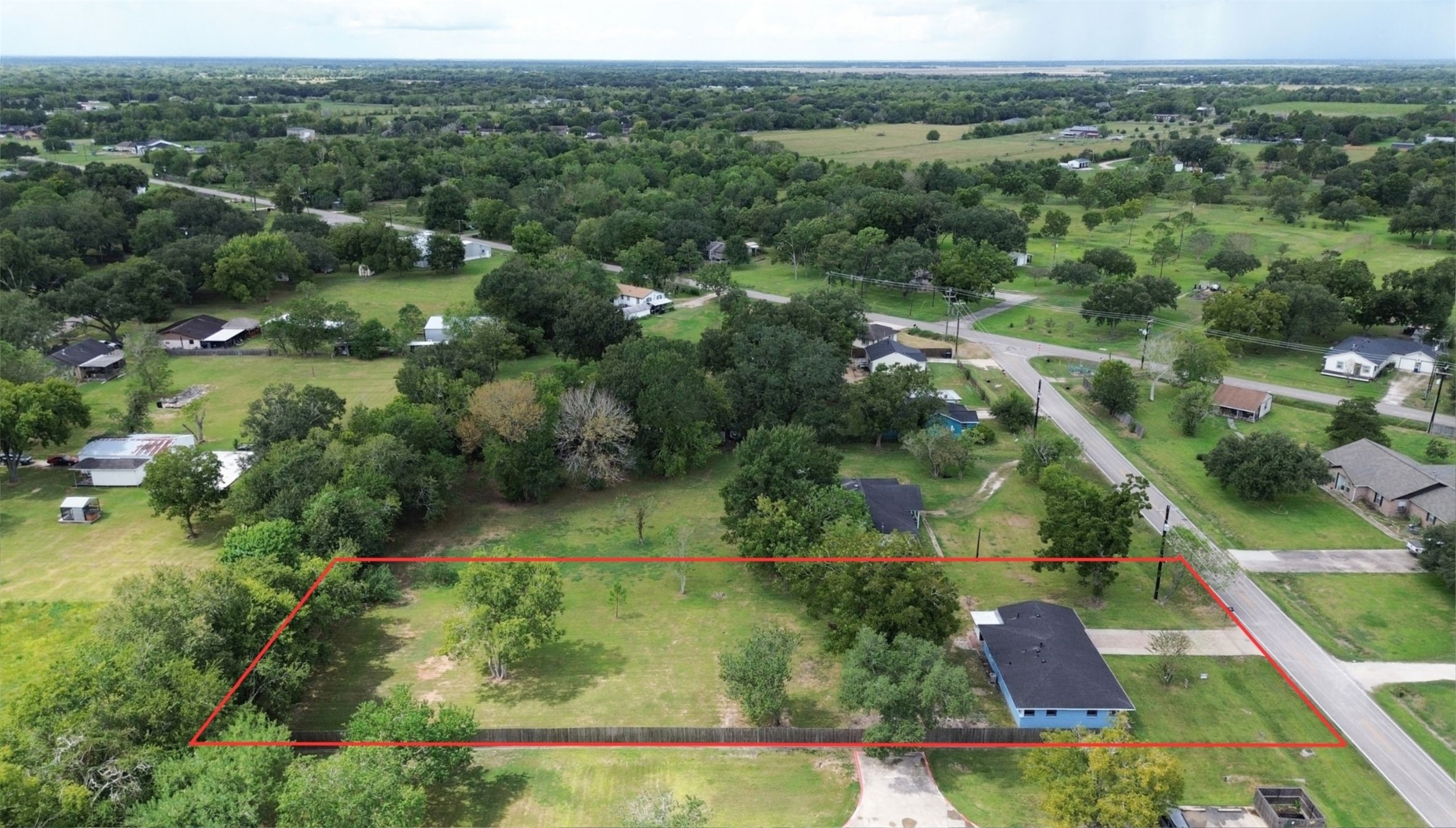 Experience tranquil rural living on this spacious lot, beautifully enveloped by lush greenery and mature trees, offering unmatched privacy and endless development possibilities. Experience tranquil rural living on this spacious lot, beautifully enveloped by lush greenery and mature trees, offering unmatched privacy and endless development possibilities.