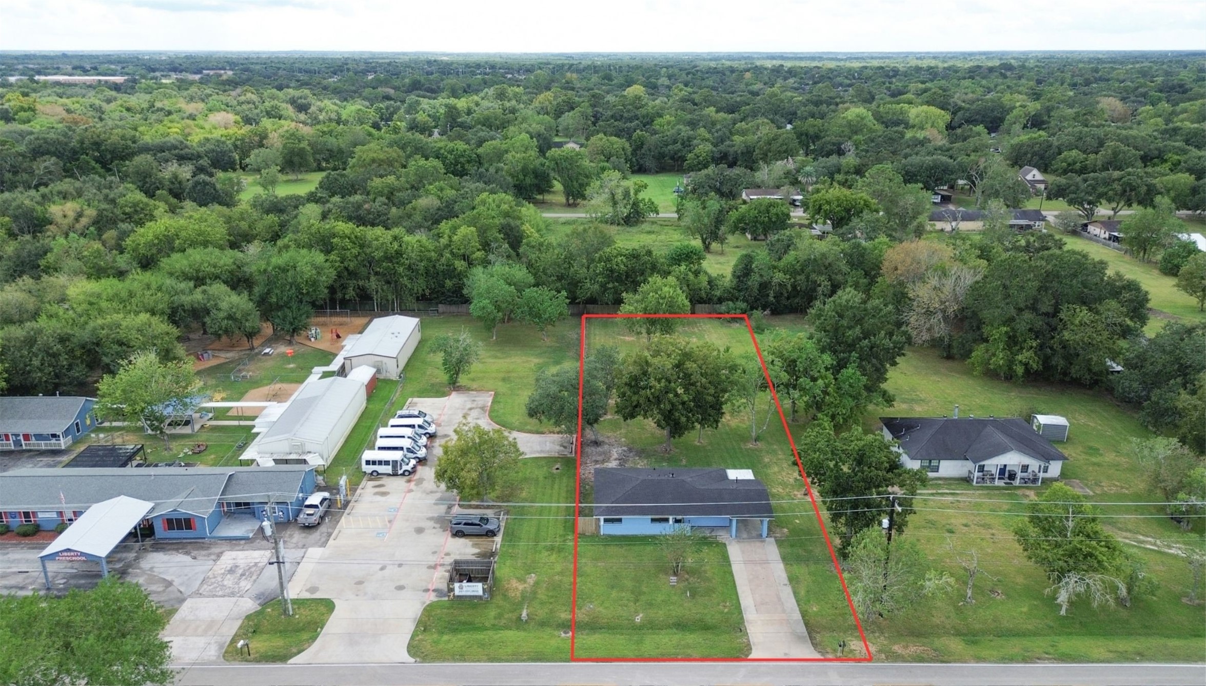 Charming single-story home nestled on a spacious, lush lot with mature trees, offering ultimate privacy and a serene atmosphere.