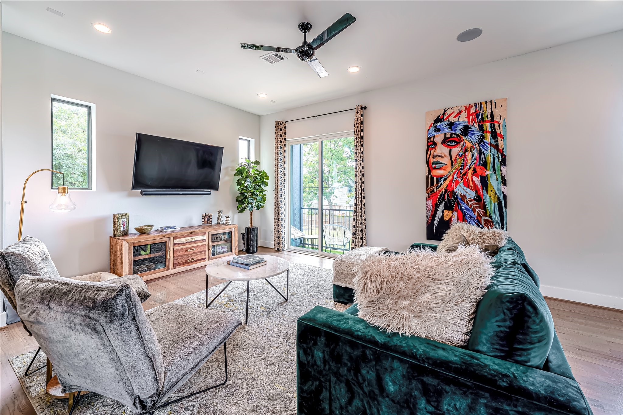 Ideal layout for entertaining with seamless flow between the living area, dining space, and kitchen.Photos reflect previous furnishings. Home is currently vacant. Furnishings shown are for illustrative purposes only.