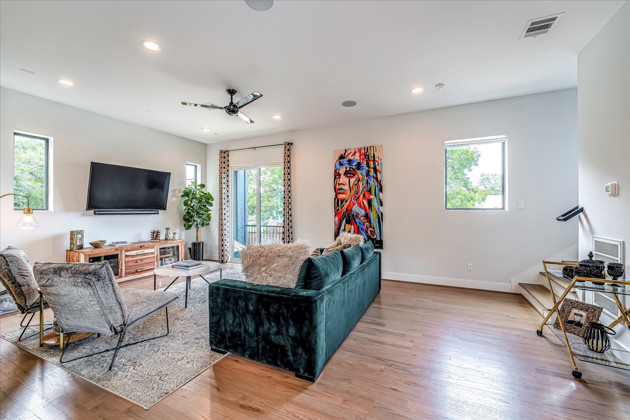 Ideal layout for entertaining with seamless flow between the living area, dining space, and kitchen. Photos reflect previous furnishings. Home is currently vacant. Furnishings shown are for illustrative purposes only.