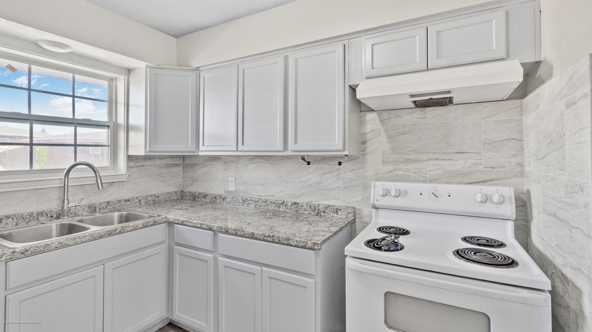 Updated Kitchen with Stove and Vent Hood