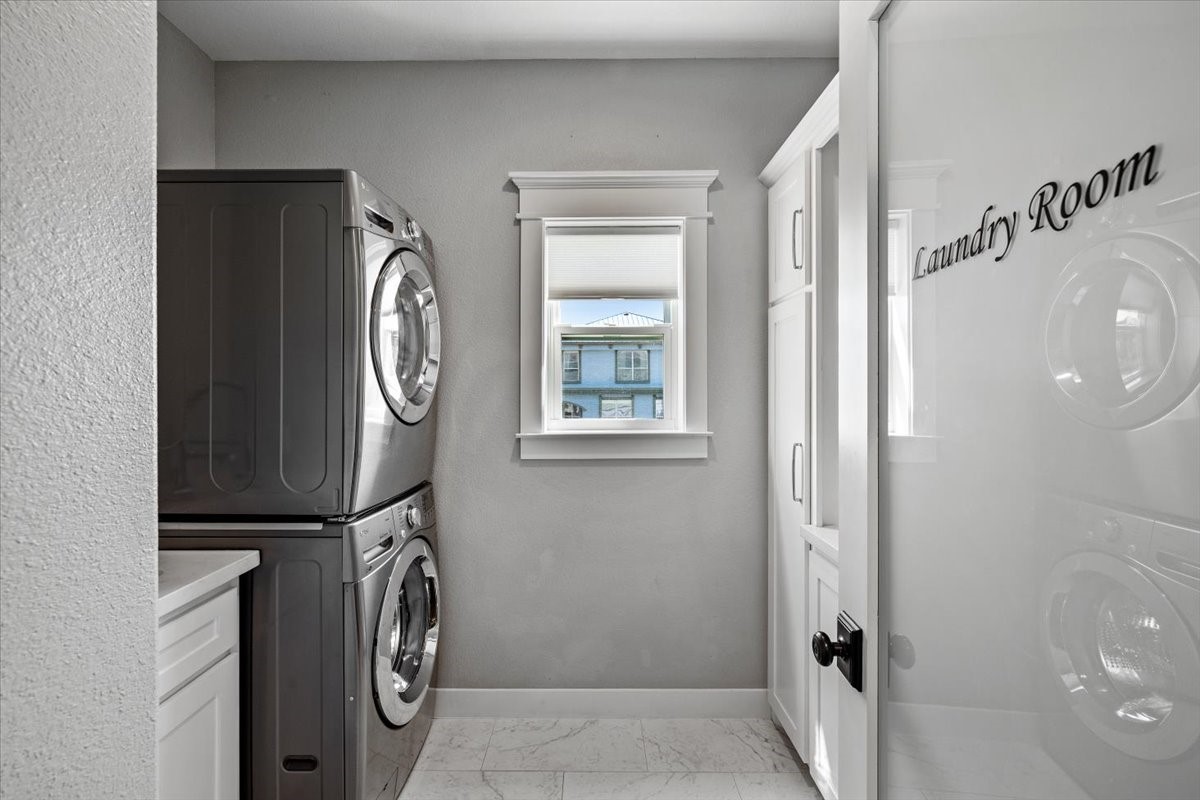 Laundry room on main level with sink and counter
