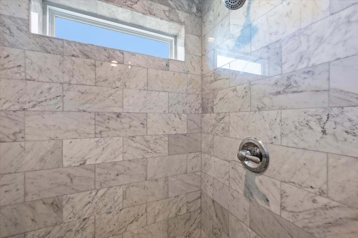 With tiled shower and window for optimal natural light