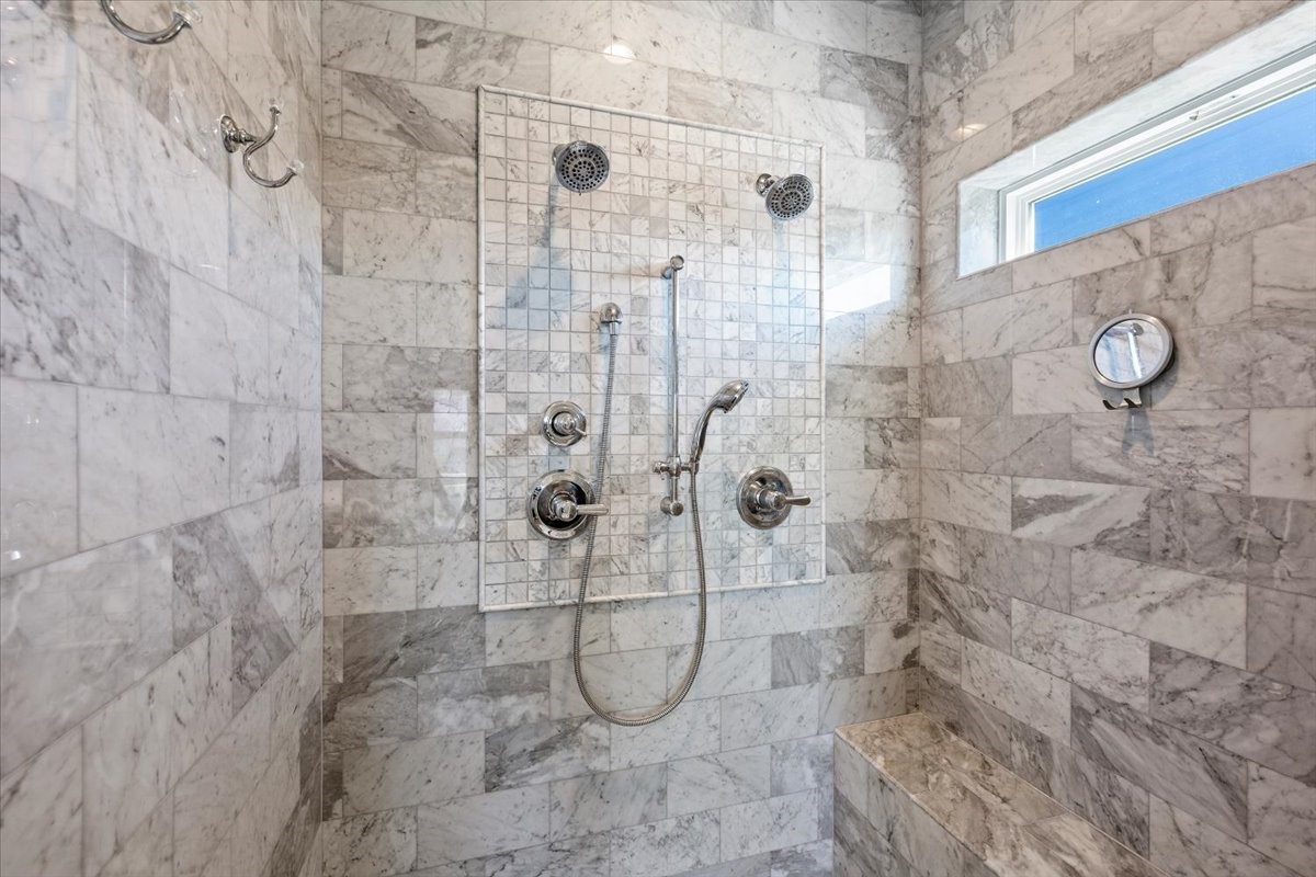 Walk-in shower with dual shower heads