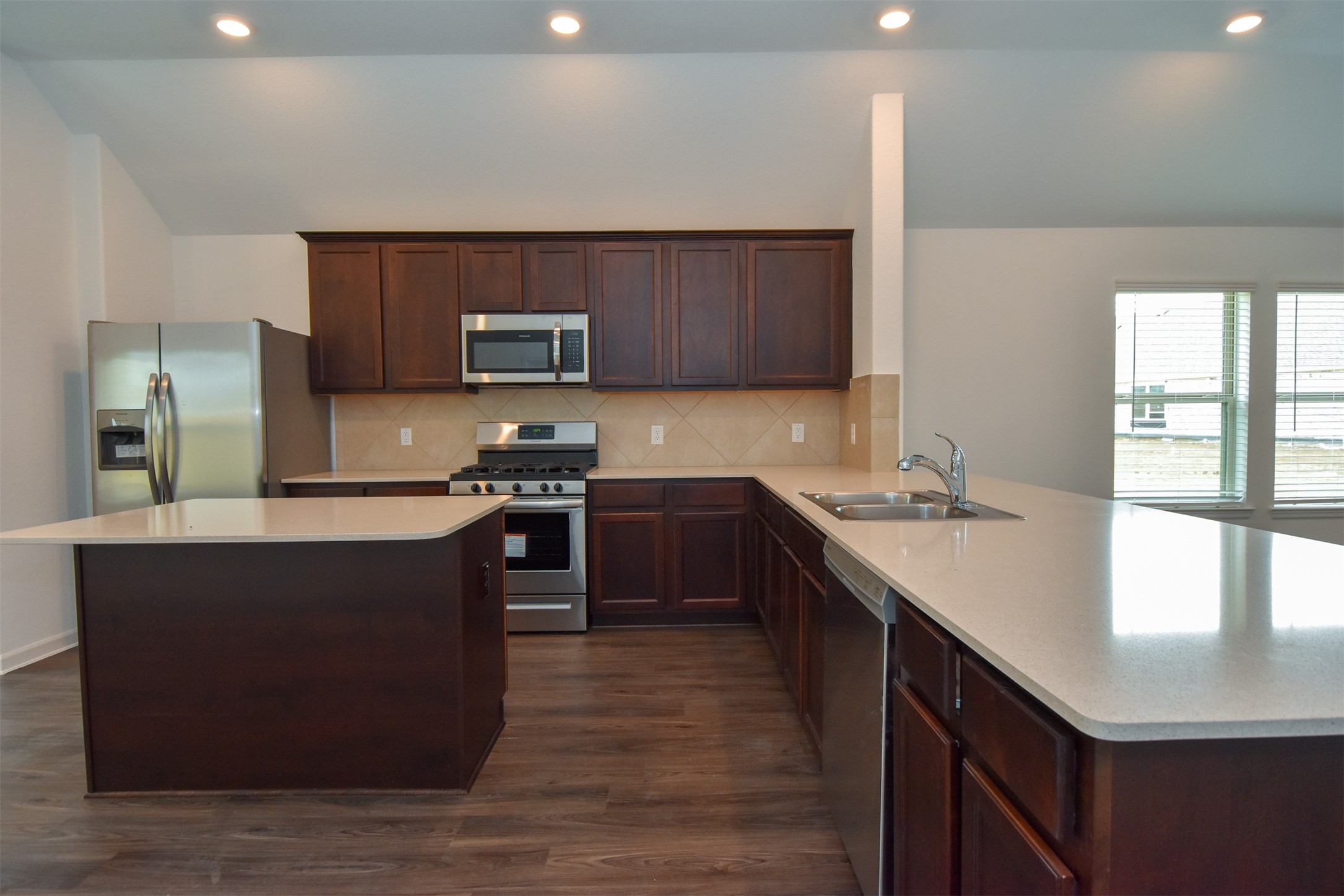 Very spacious kitchen w/island, Corian counter tops and stainless steal appliances