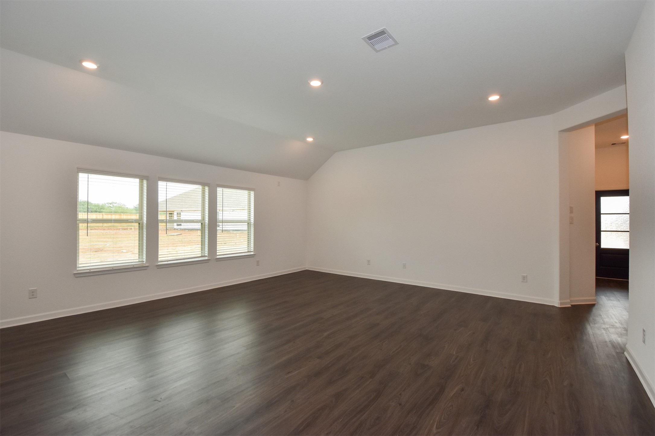 From here you can see the windows allow for tons of natural lighting to flood the family room