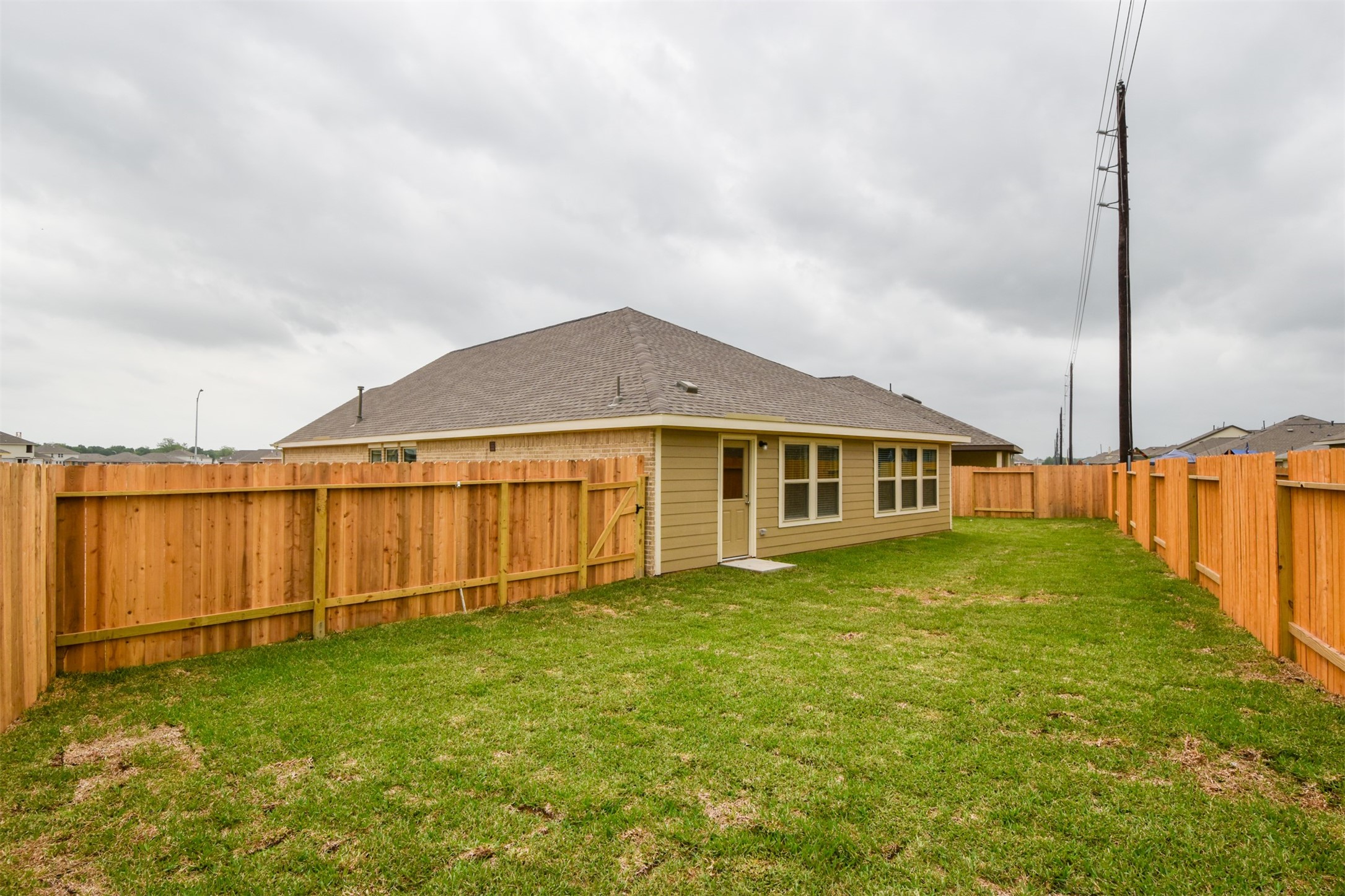 Large backyard area perfect for outdoor playground or above ground pool