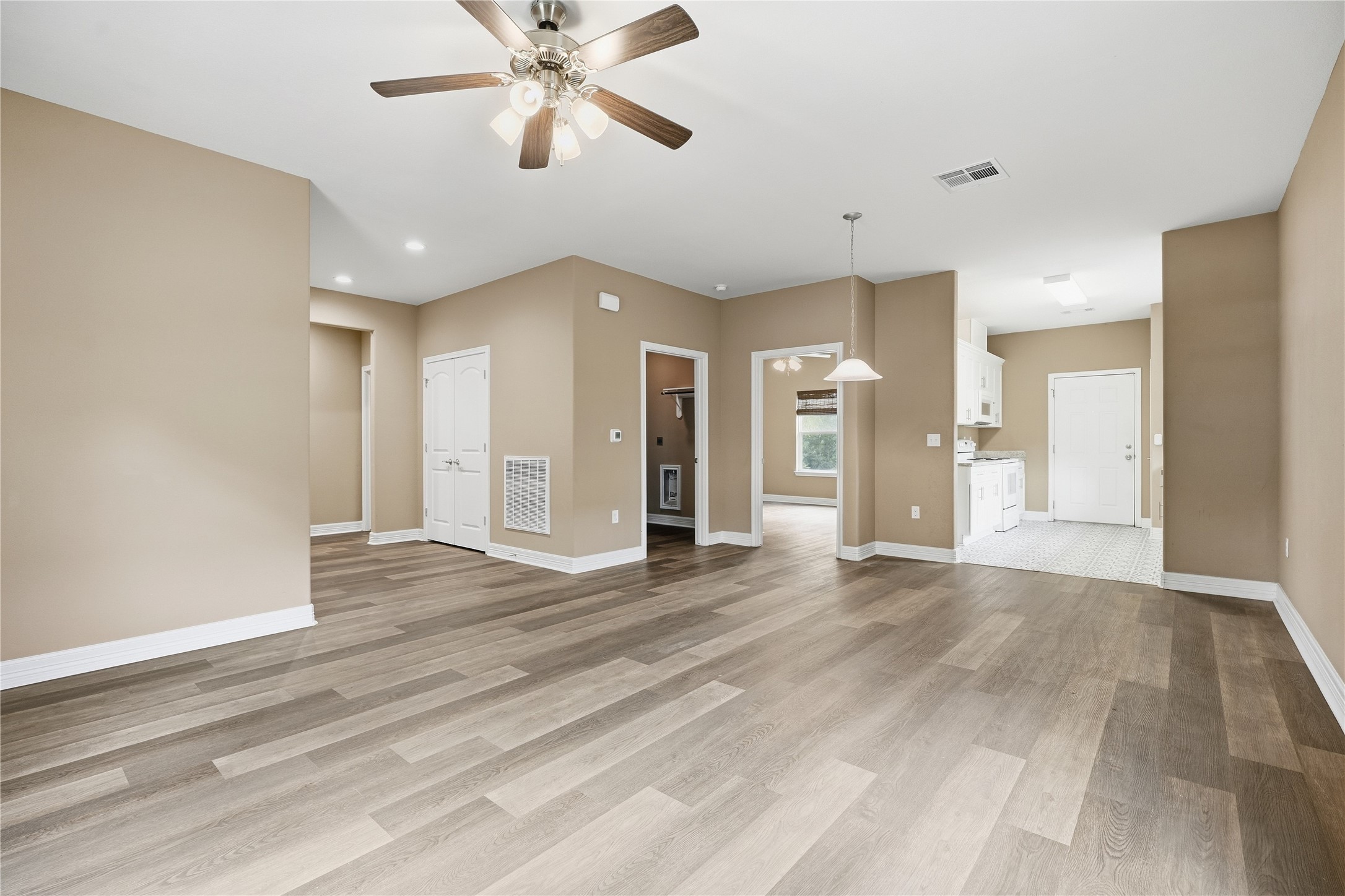 The living room opens to the dining area and kitchen, making it easy to spend time with guests while preparing a meal.
