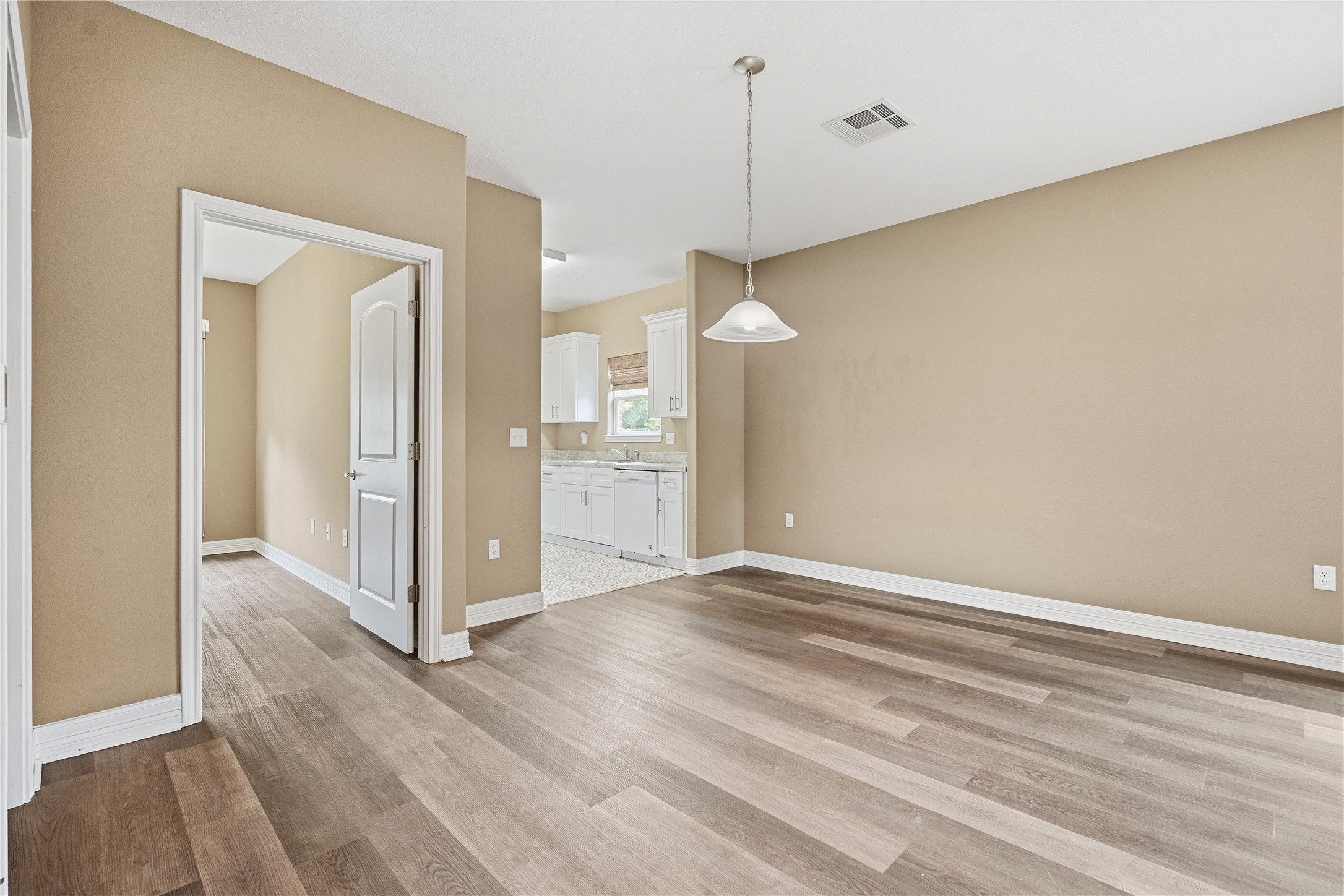 The living room opens to the dining area and kitchen, making it easy to spend time with guests while preparing a meal.